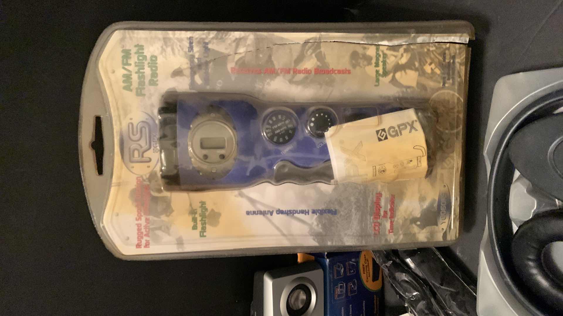 Photo 1 of ELECTRONICS ASSORTMENT, FLASHLIGHT RADIO, WIRELESS HEADPHONES, TRAVEL SOUND AND MORE