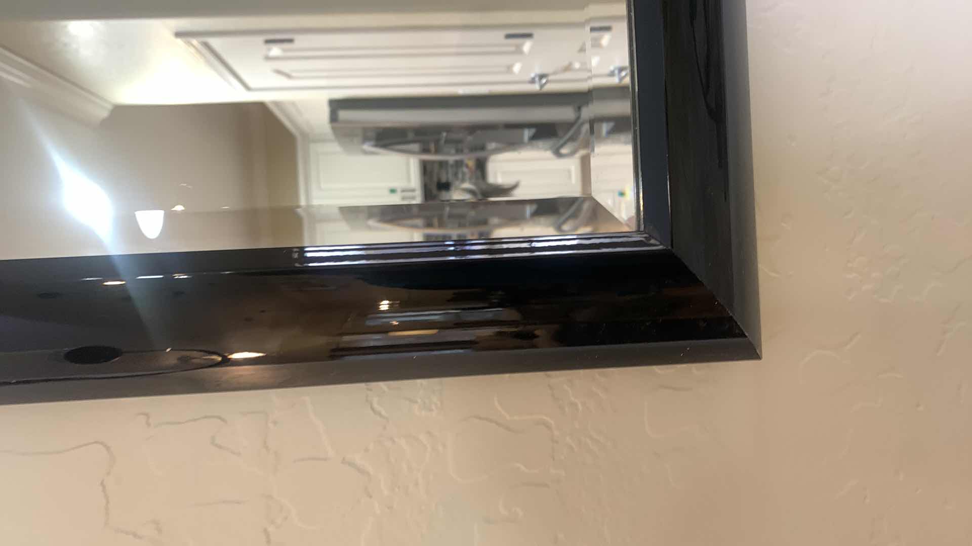 Photo 1 of BLACK LACQUER FRAMED BEVELED GLASS MIRROR 60” x 36” W TWO METAL SCULPTURED SCONCES