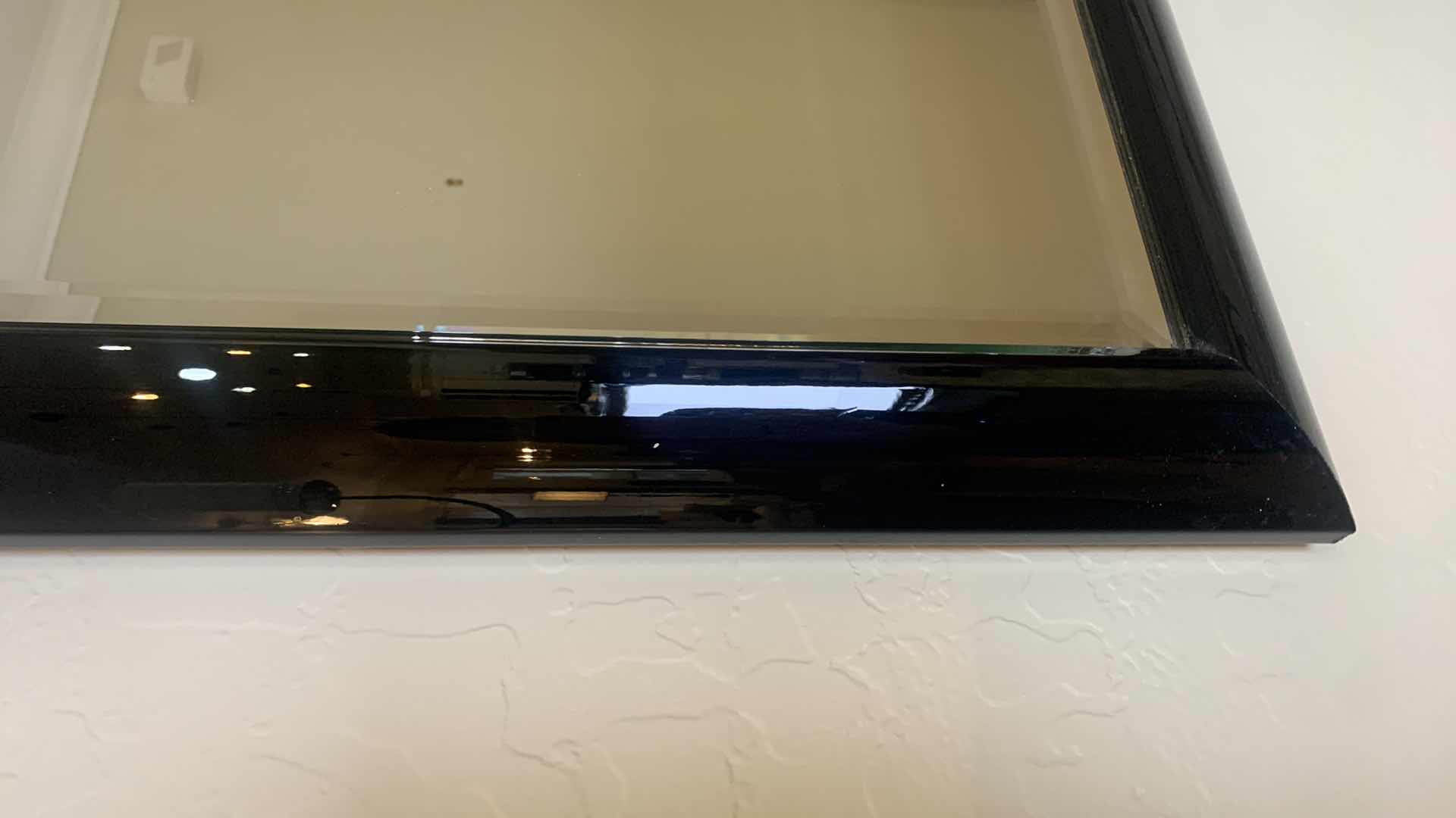 Photo 1 of BLACK LACQUER FRAMED BEVELED GLASS MIRROR 60” x 36” W TWO METAL SCULPTURED SCONCES