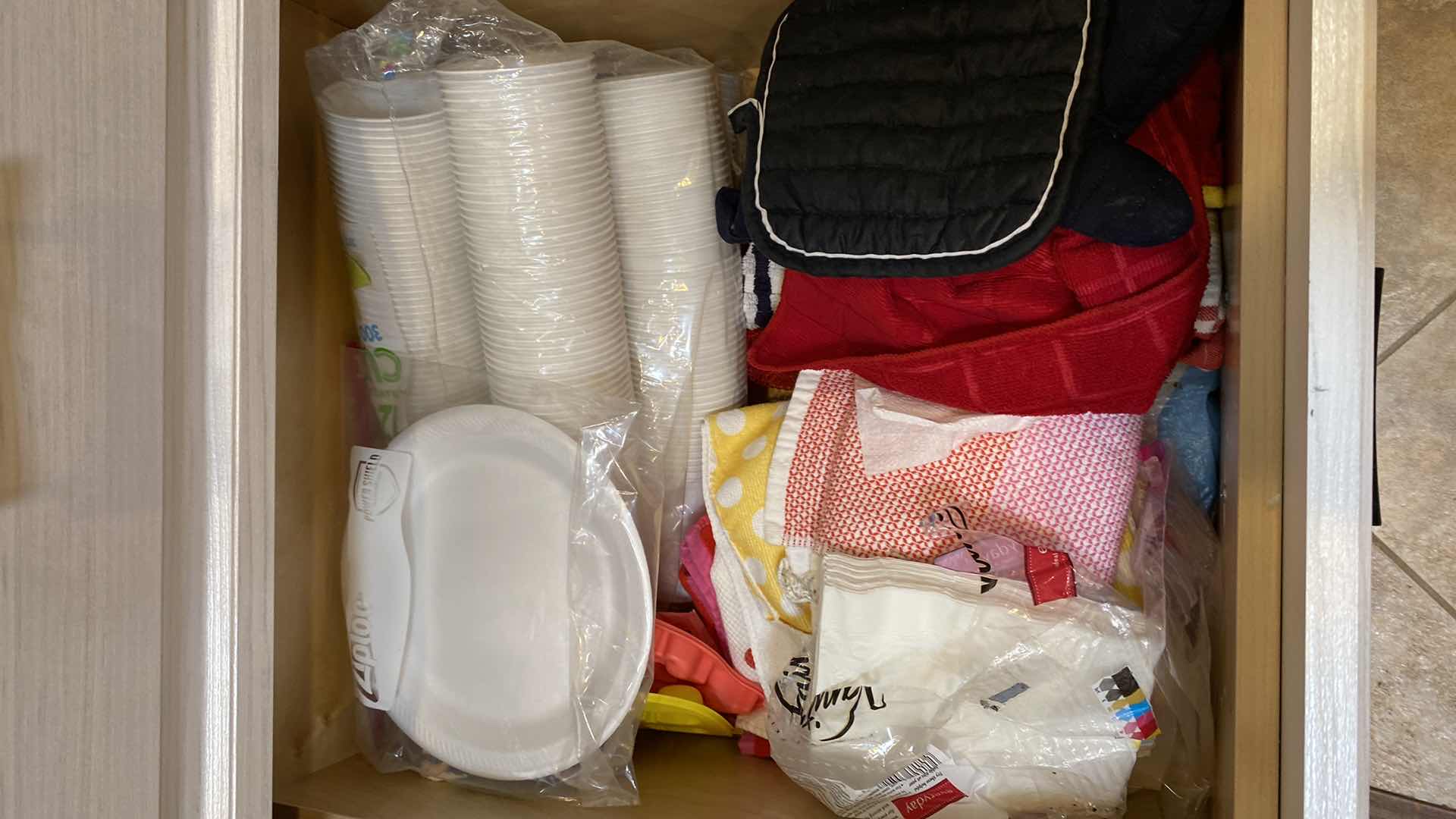 Photo 2 of CONTENTS OF DRAWER-16 PLACEMATS KITCHEN TOWELS POT HOLDERS PLASTIC CUPS