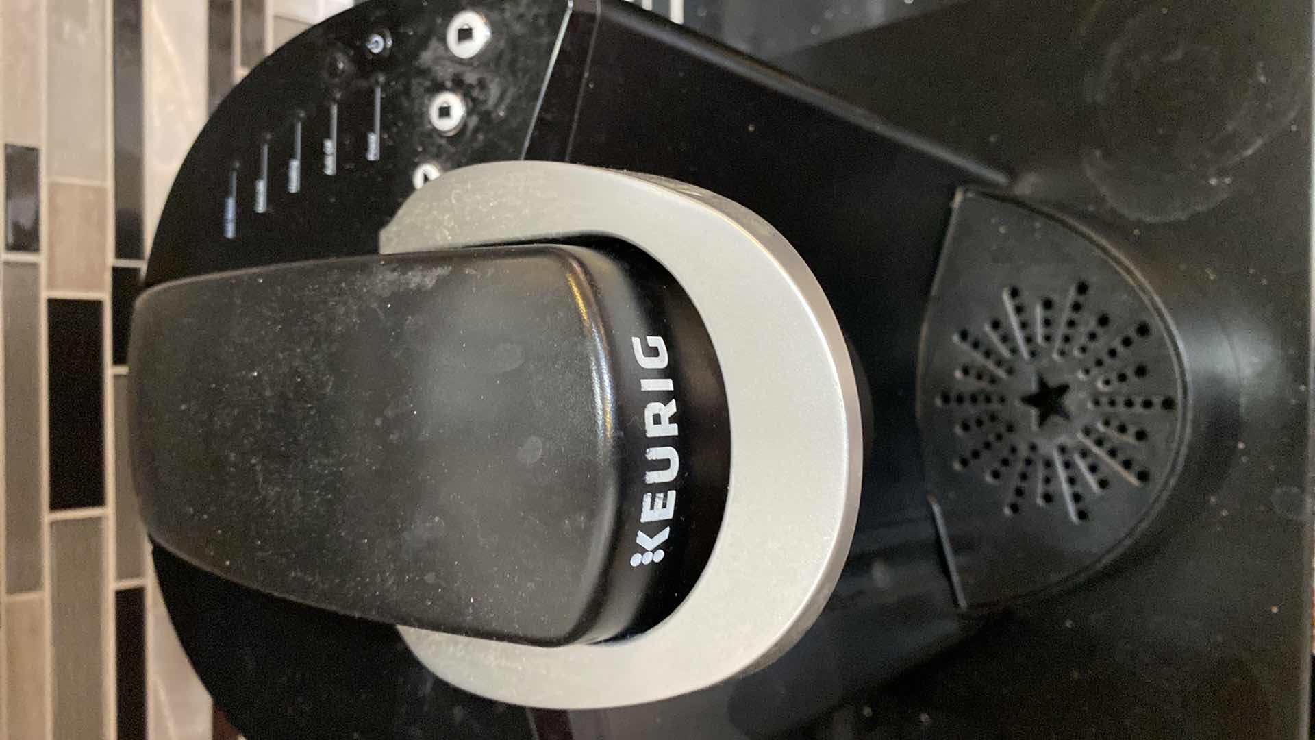 Photo 1 of KEURIG COFFEE MAKER WITH POD STORAGE AND PODS