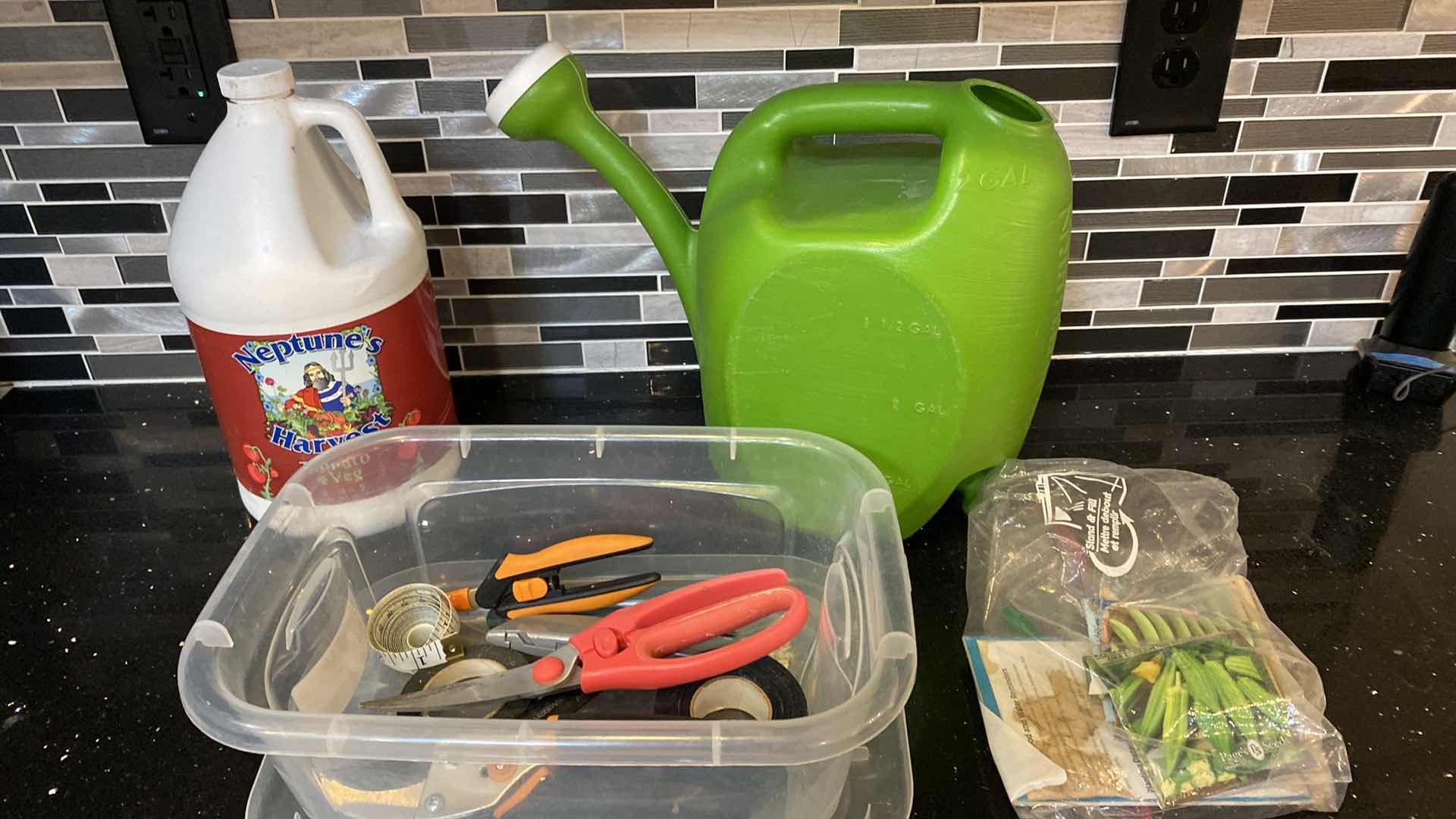 Photo 1 of GARDENING TOOLS AND NEPTUNES HARVEST FERTILIZER