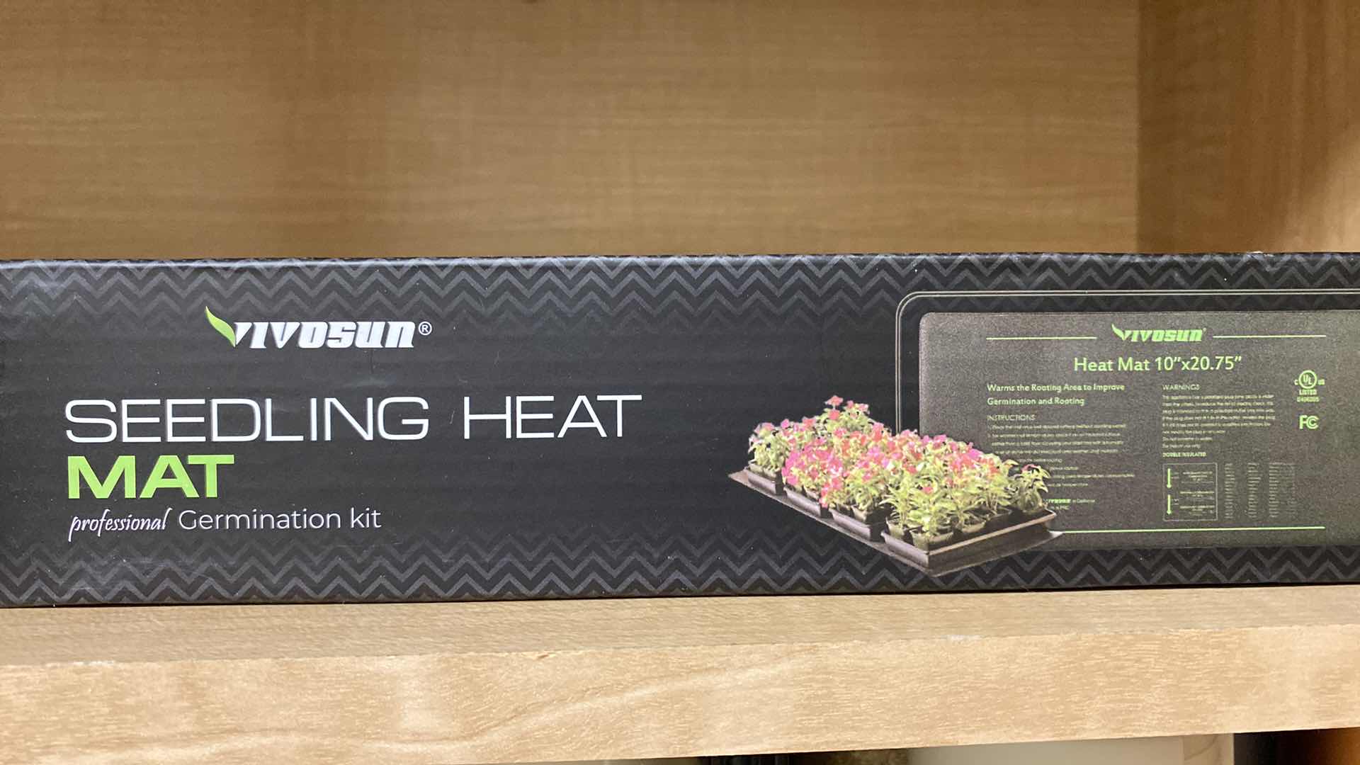 Photo 1 of CONTENTS OF CABINET SEED MAT, SPRAY PAINT AND LAUNDRY SUPPLIES