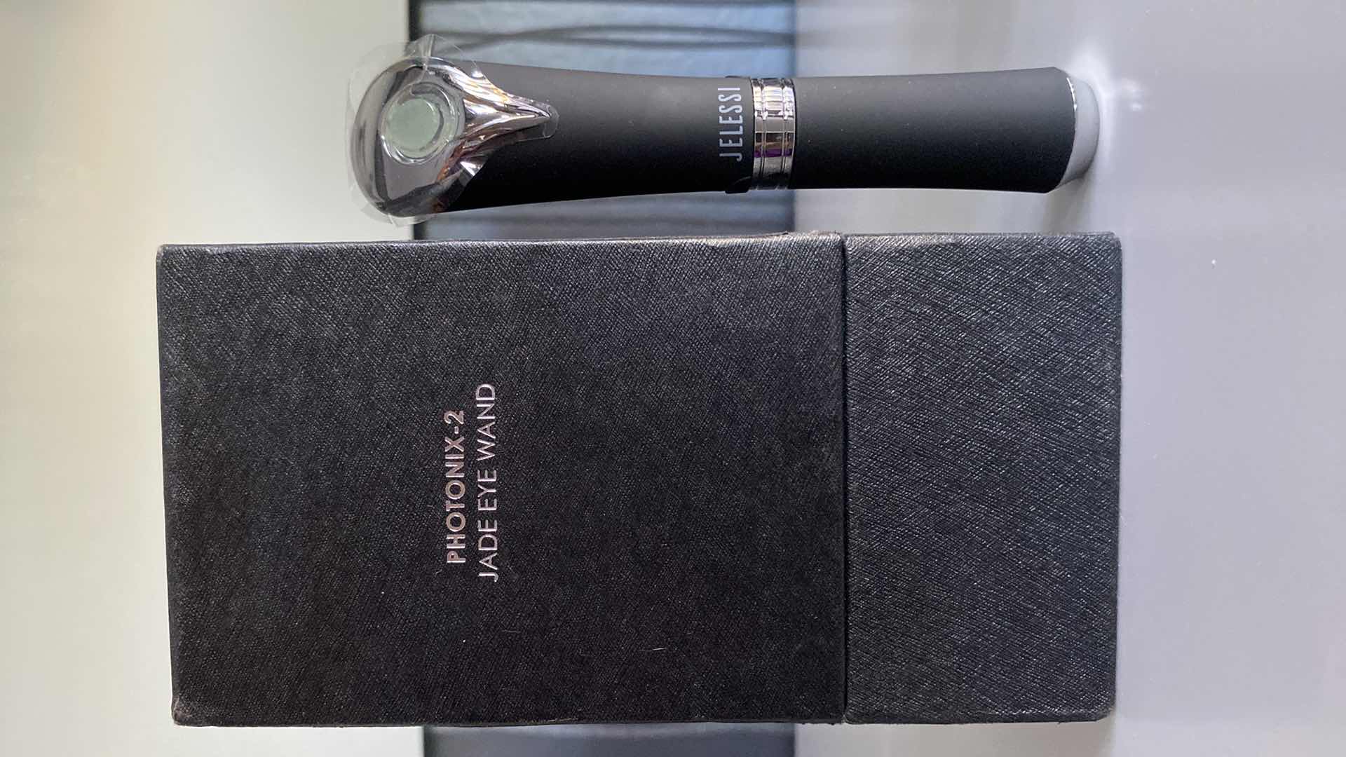 Photo 1 of JELESSI PHOTONIX 2 JADE EYE WAND-NATURAL JADE STONE TO RELIEVE SKIN TENSION PROMOTE CIRCULATION, BLUE RELIEF MODE AND RED LIFTING MODE.