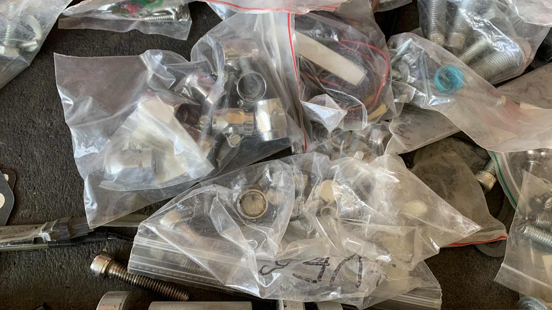 Photo 1 of MOTORCYCLE HARDWARE INCLUDING HARLEY DAVIDSON AXEL BOLT