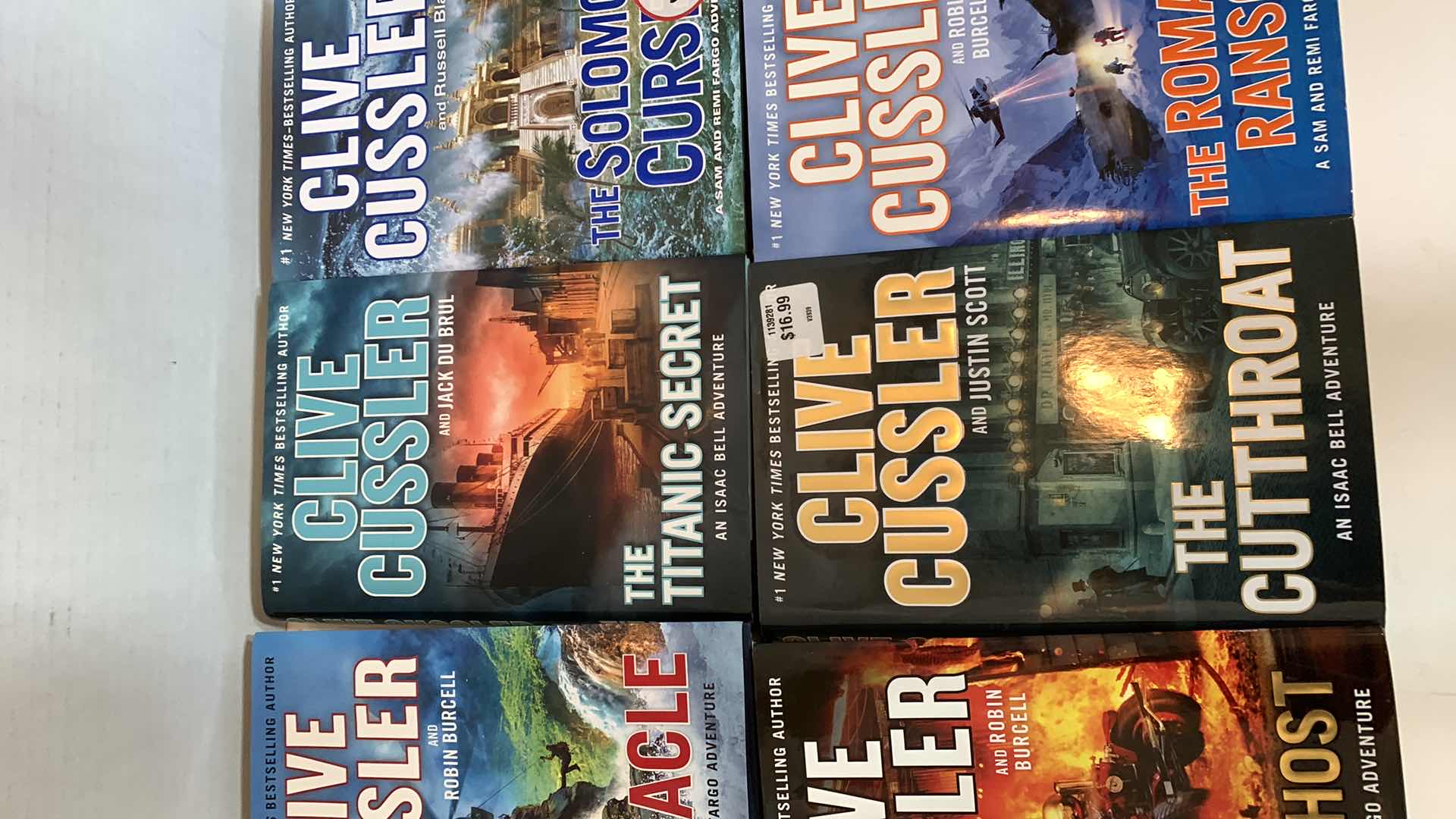 Photo 1 of 6-CLIVE CUSSLER HARD COVER BOOKS