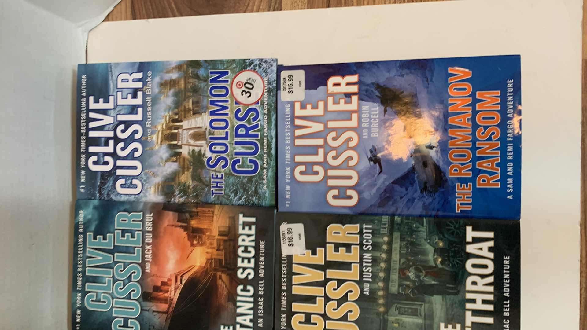 Photo 1 of 6-CLIVE CUSSLER HARD COVER BOOKS