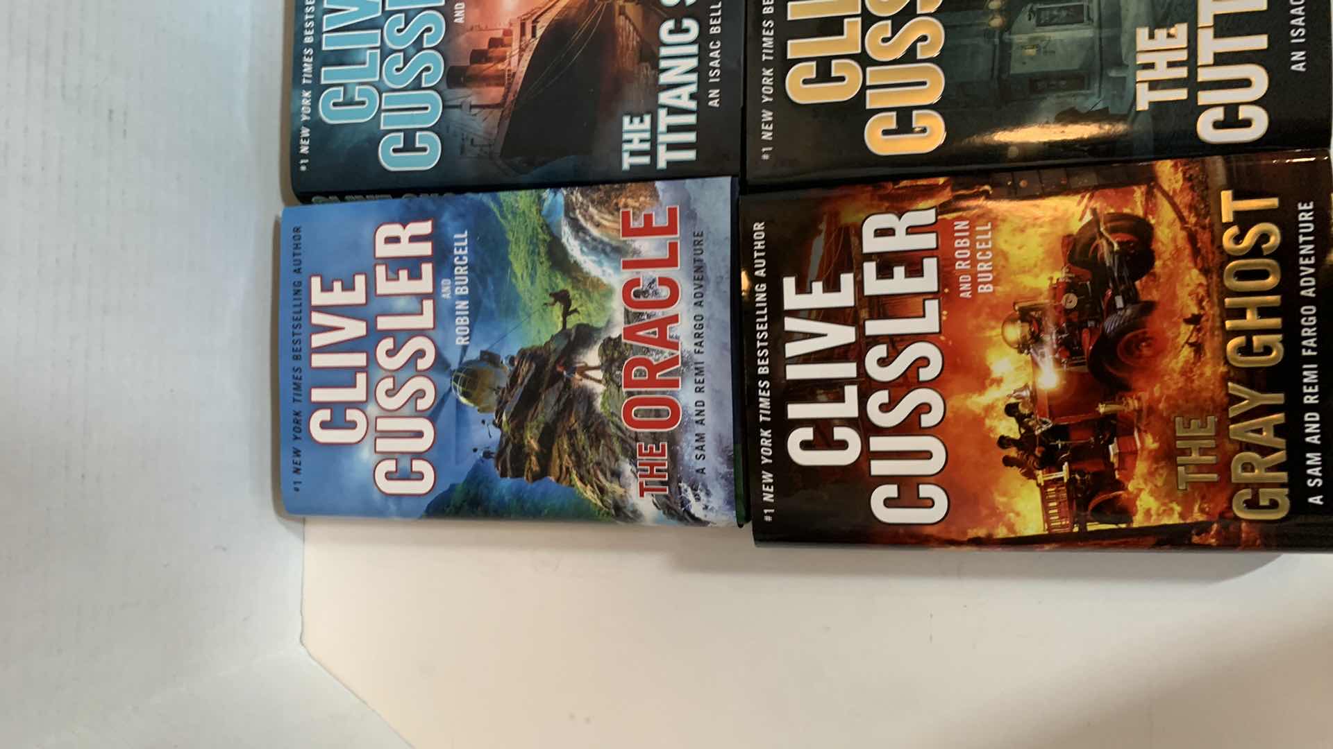 Photo 1 of 6-CLIVE CUSSLER HARD COVER BOOKS