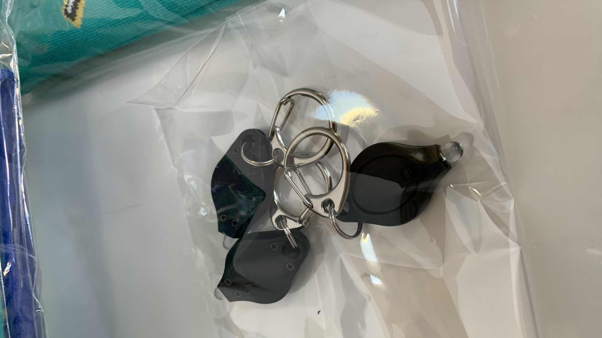 Photo 1 of 6-PAIRS OF SOCKS,SHAMPOO HEAD SUPPORT, AND KEY CHAIN LIGHTS