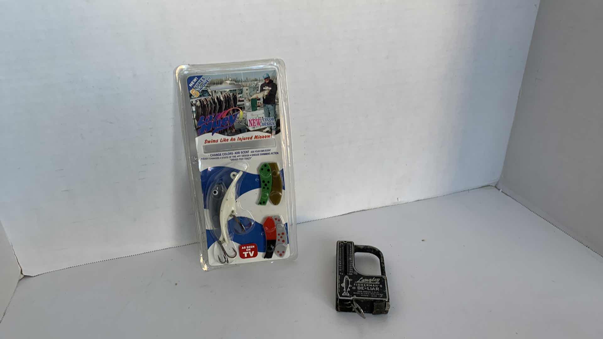 Photo 1 of VINTAGE FISHING LURE AND ZEBCO SCALE