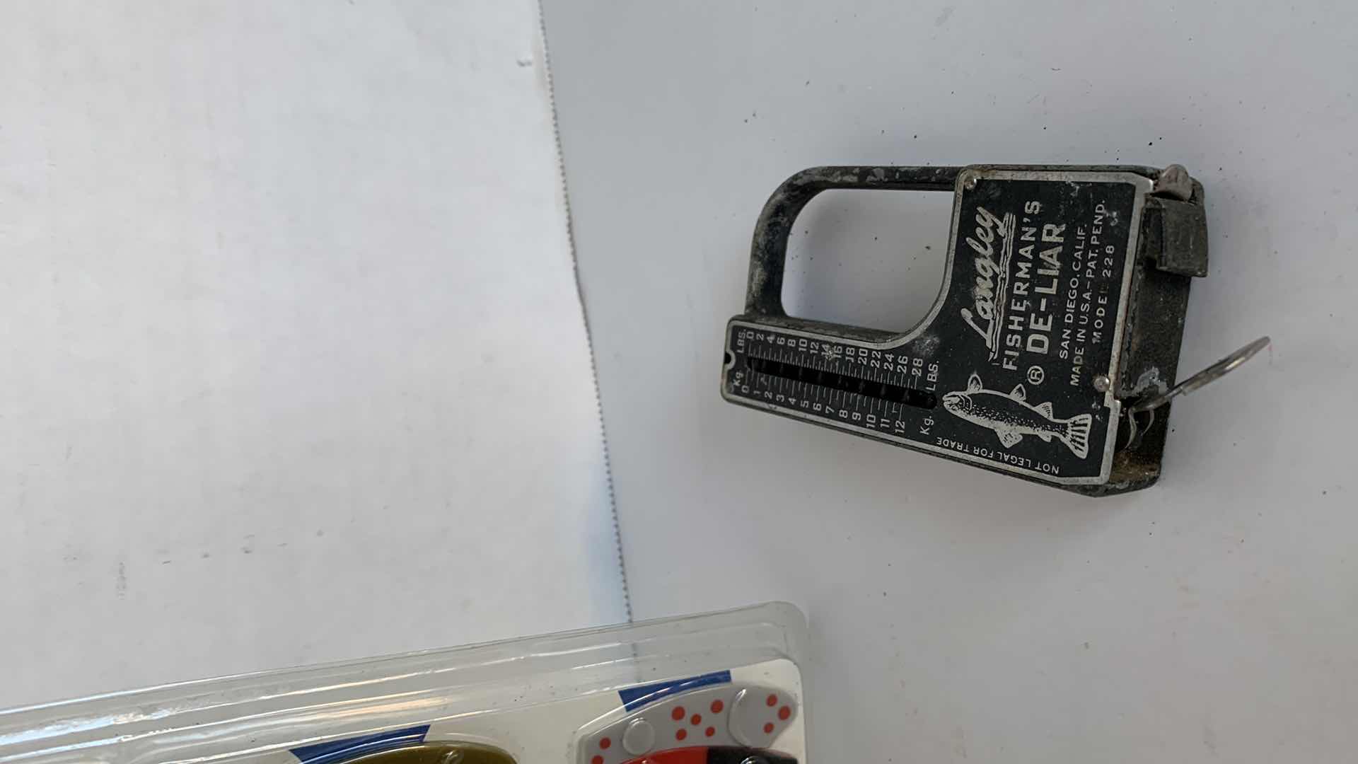 Photo 1 of VINTAGE FISHING LURE AND ZEBCO SCALE