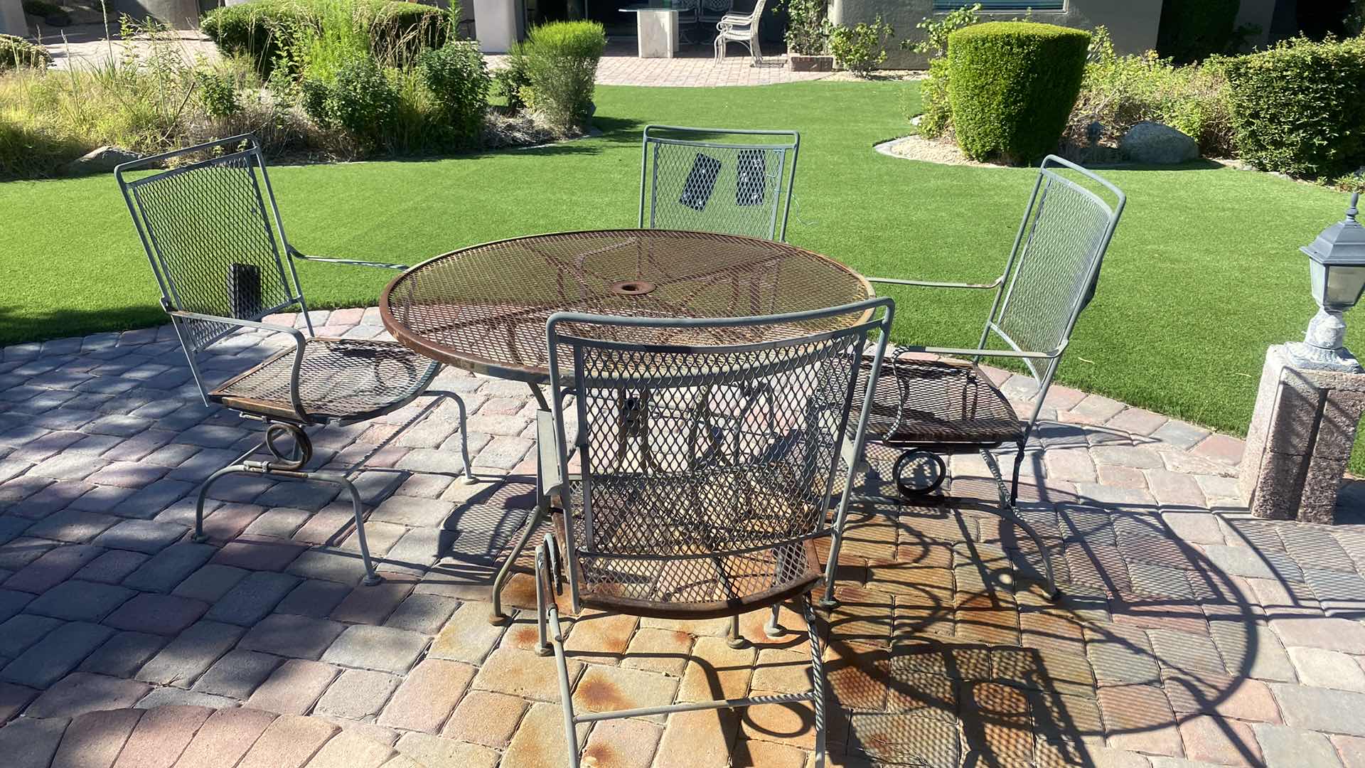 Photo 1 of 42" ROUND WROUGHT IRON PATIO TABLE W 4 ARM CHAIRS 