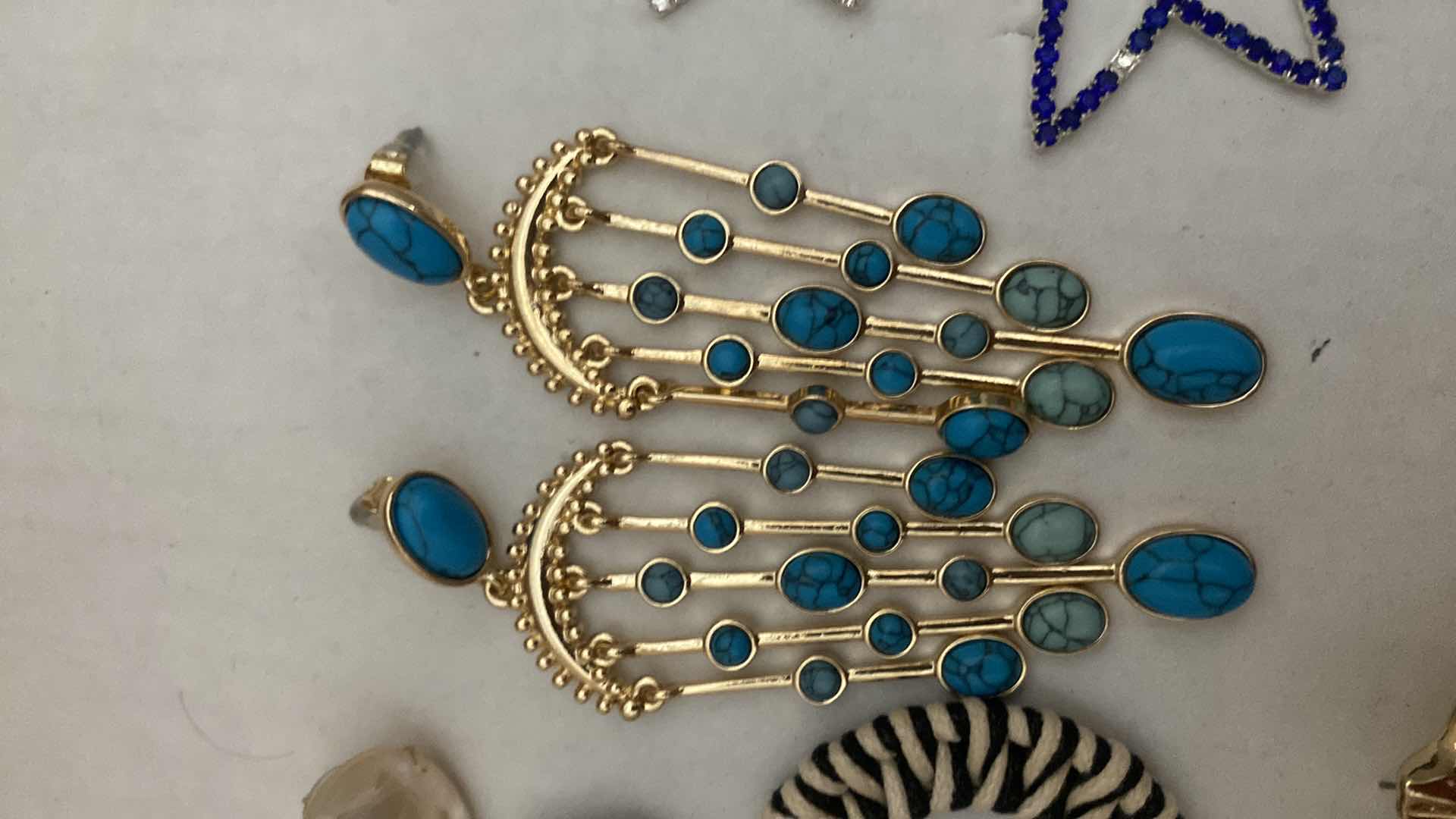 Photo 1 of COSTUME JEWELRY- STONE MISSING ON STAR EARRINGS