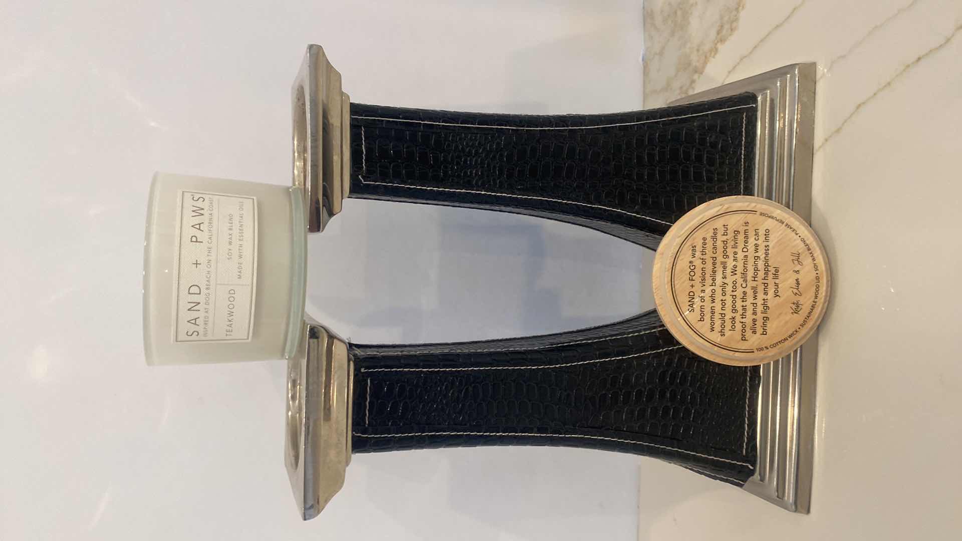 Photo 1 of PAIR OF BLACK FAUX ALLIGATOR AND CHROME CANDLE HOLDERS H 13” AND SAND & PAWS SOY CANDLE