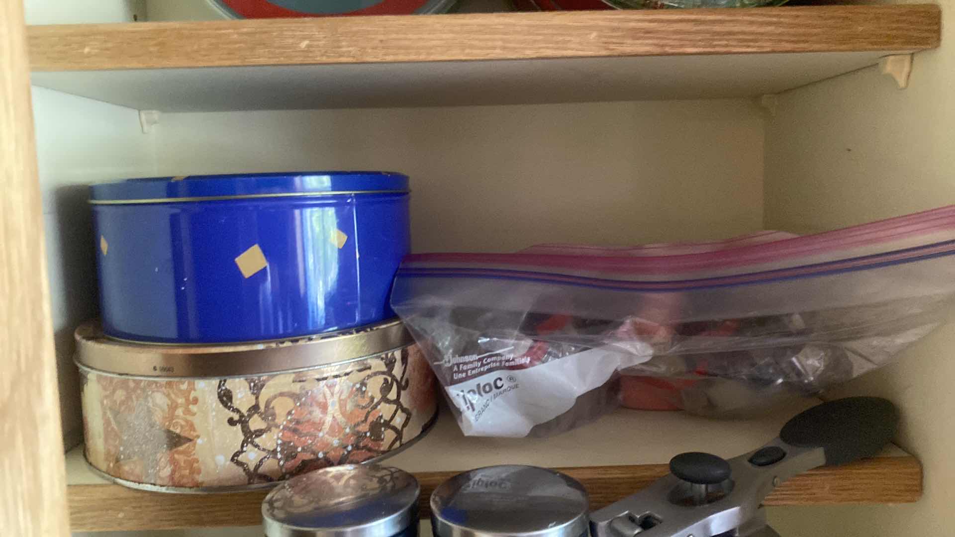 Photo 1 of CONTENTS KITCHEN CABINET - SALT & PEPPER GRINDERS, TINS & COOKIE CUTTERS