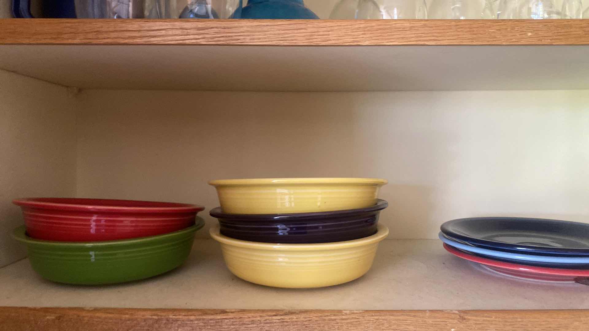 Photo 1 of CONTENTS OF KITCHEN CABINET - FIESTA PLATES & BOWLS & ASSORTED GLASSWARE