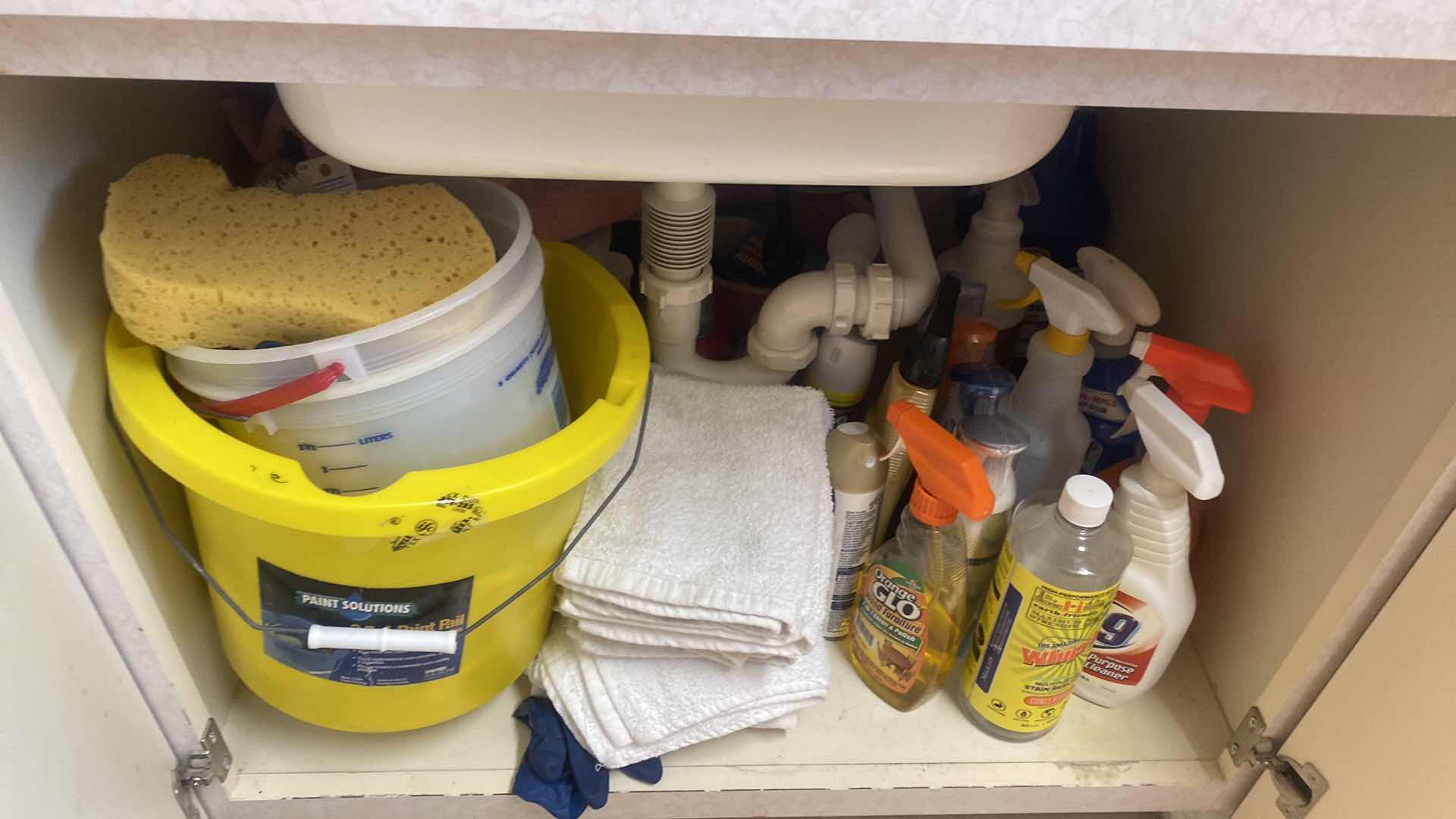 Photo 1 of CONTENTS OF LAUNDRY ROOM CABINET - UNDER SINK CLEANING SUPPLIES AND TOWELS