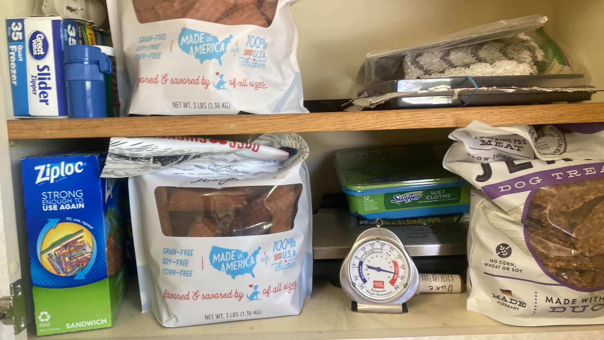 Photo 1 of CONTENTS OF LAUNDRY ROOM CABINET - CLEANING, ZIP LICKS & DOG TREATS