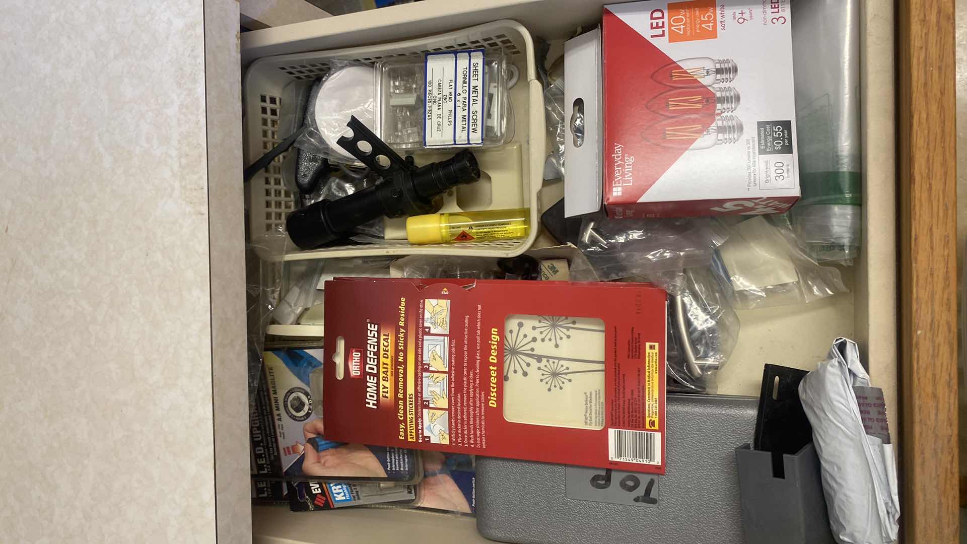 Photo 1 of CONTENTS OF LAUNDRY ROOM CABINET - 3 DRAWERS BULBS BATTERIES & MORE