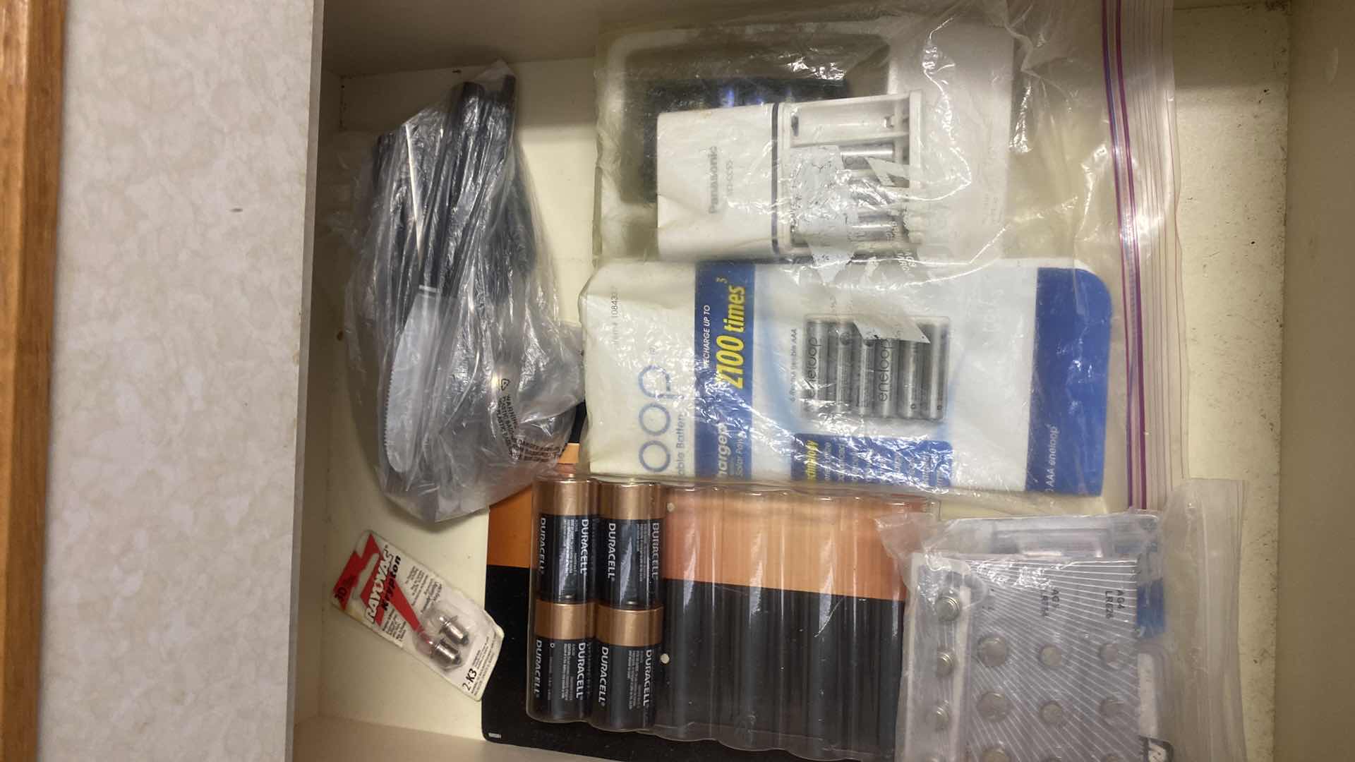 Photo 1 of CONTENTS OF LAUNDRY ROOM CABINET - 3 DRAWERS BULBS BATTERIES & MORE