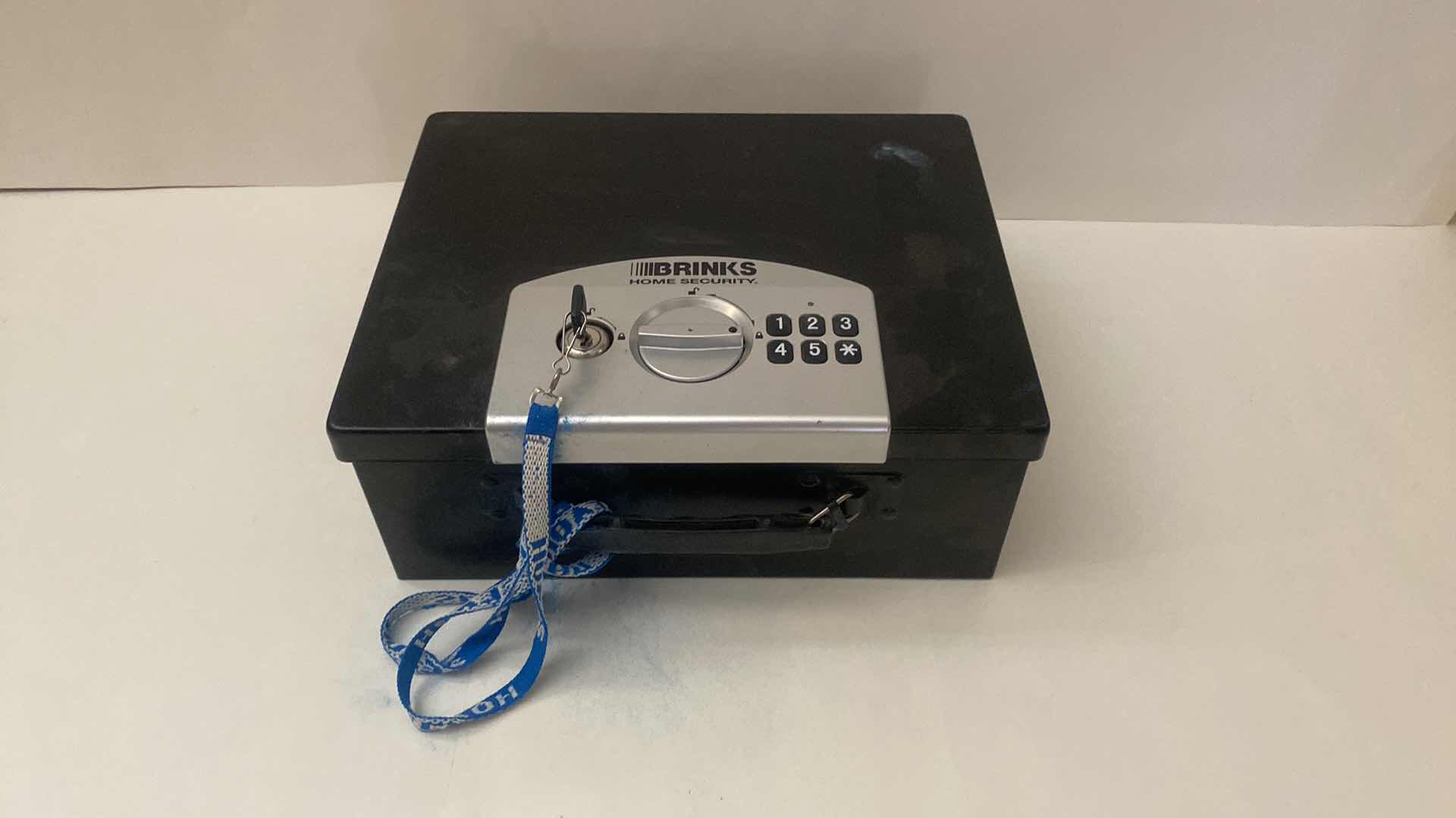 Photo 1 of BRINKS HOME SECURITY BOX WITH KEY (combination not known)