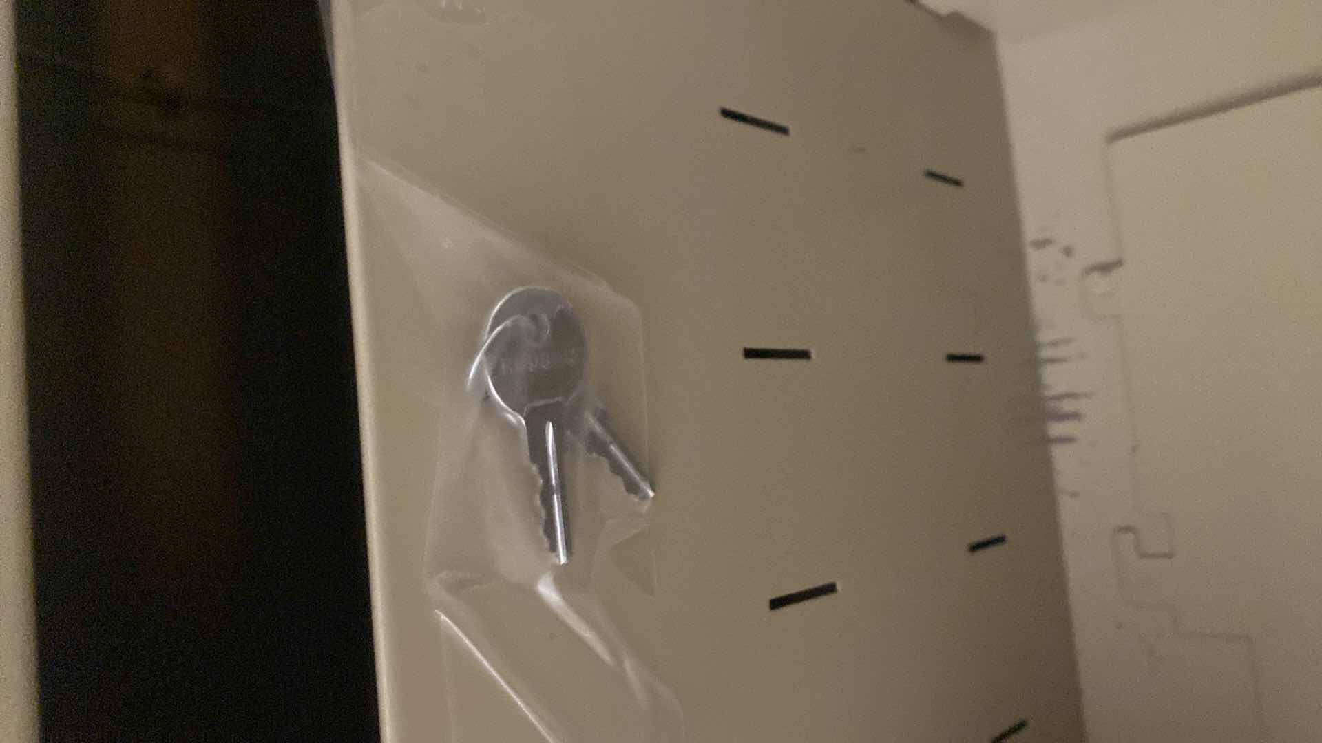 Photo 1 of 4 DRAWER FILE CABINET WITH POWER STRIP & KEYS 30“ x 14 1/2“ H 52”