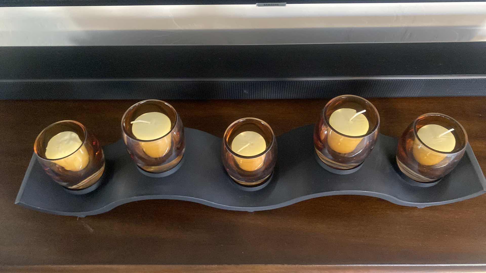 Photo 1 of BLACK METAL CANDLE HOLDER WITH 5 GLASS VOTIVE HOLDERS 24” x 6”