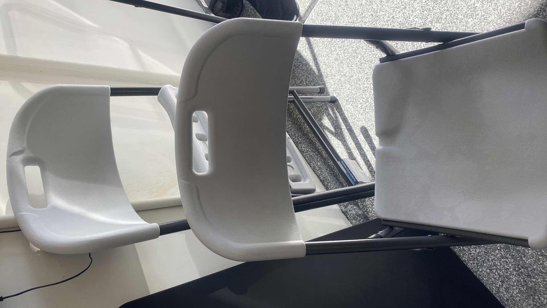 Photo 1 of FOLDED CARD TABLE & 4 PLASTIC CHAIRS