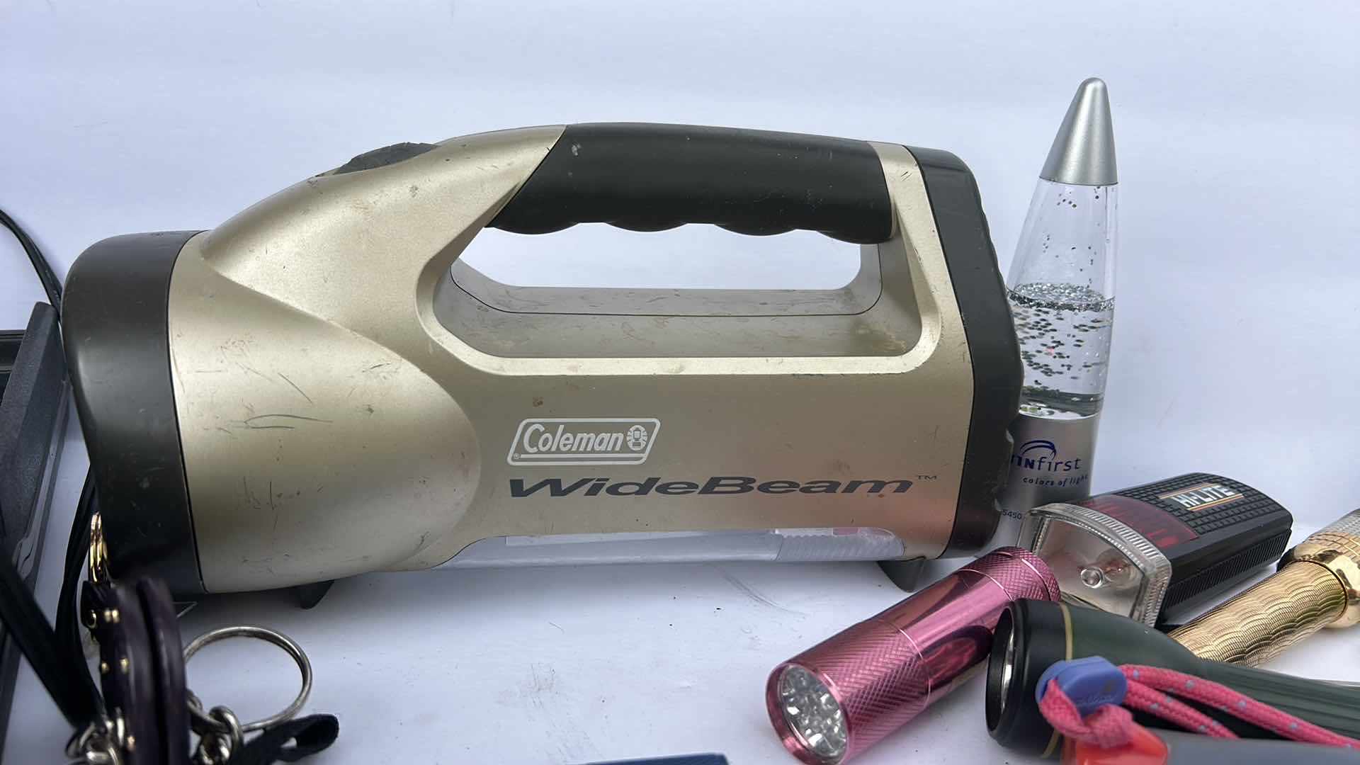 Photo 1 of FLASHLIGHTS, BATTERY CHARGER AND KEY CHAINS