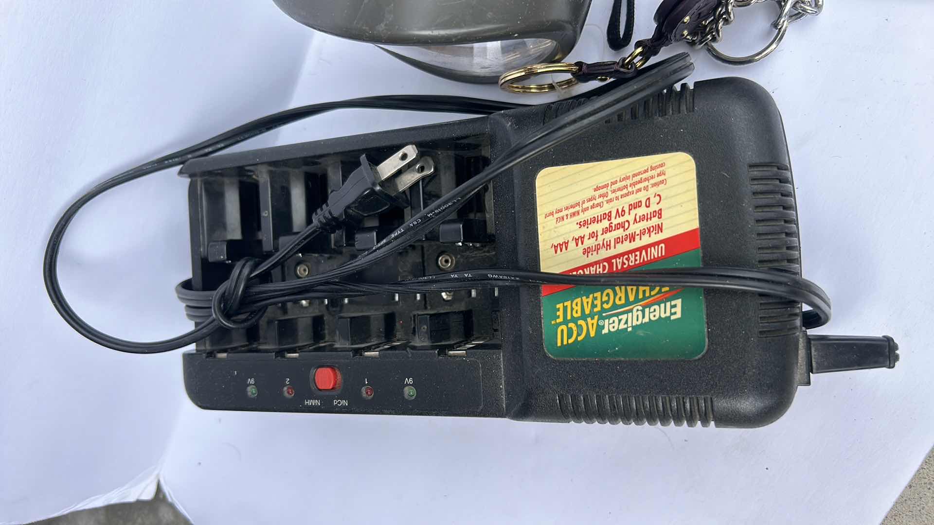 Photo 1 of FLASHLIGHTS, BATTERY CHARGER AND KEY CHAINS