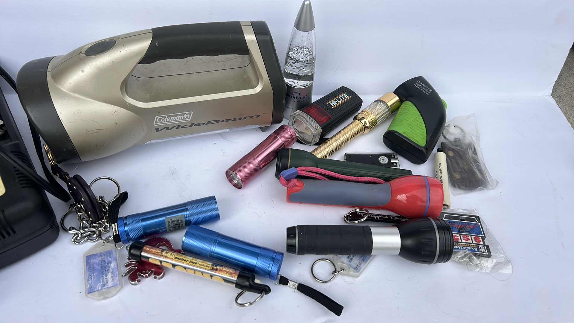 Photo 1 of FLASHLIGHTS, BATTERY CHARGER AND KEY CHAINS
