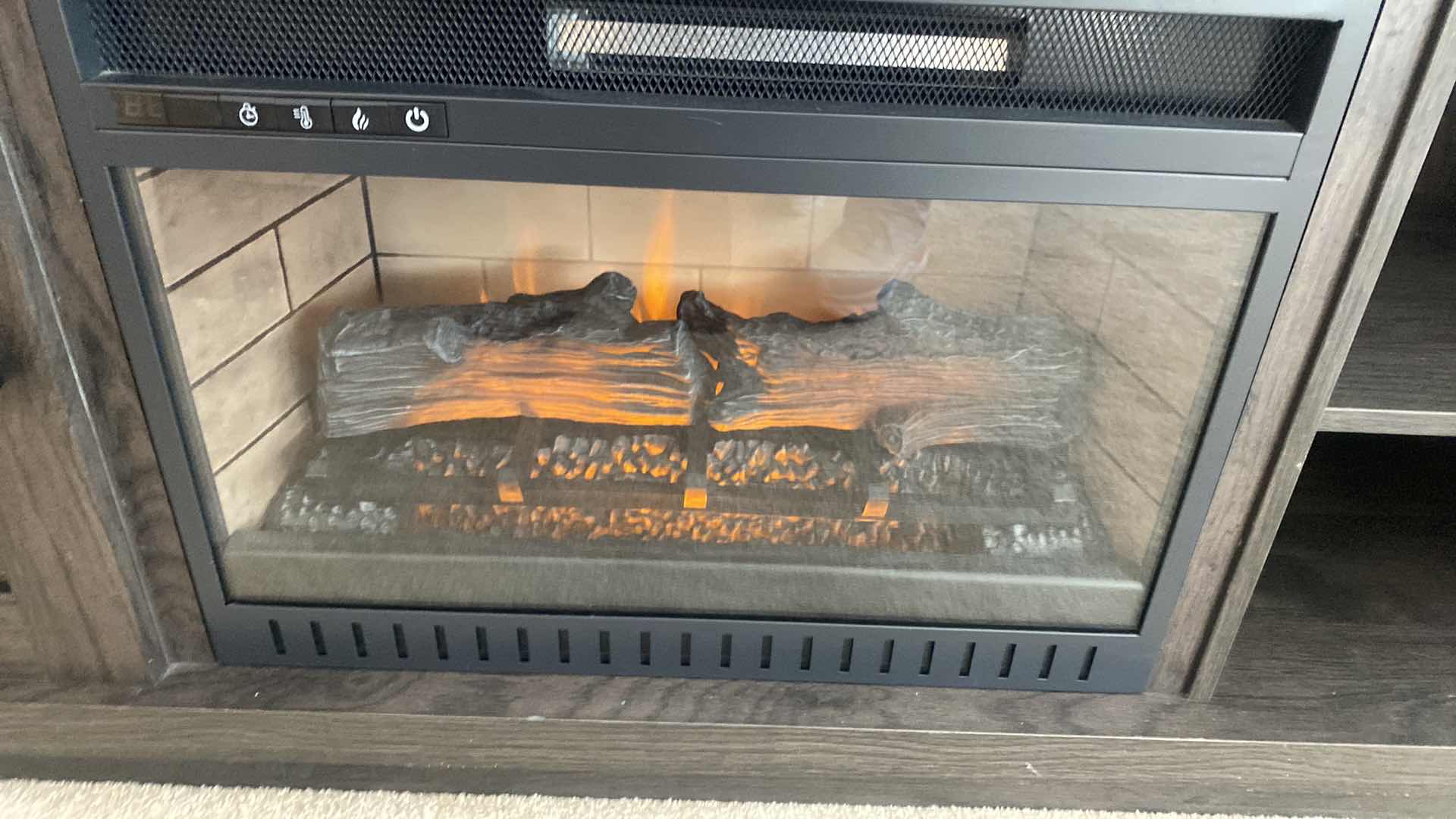 Photo 1 of VENEER WOOD ENTERTAINMENT CENTER WITH ELECTRIC FIREPLACE & REMOTE (needs batteries) 54” x 15 1/2” H 33”