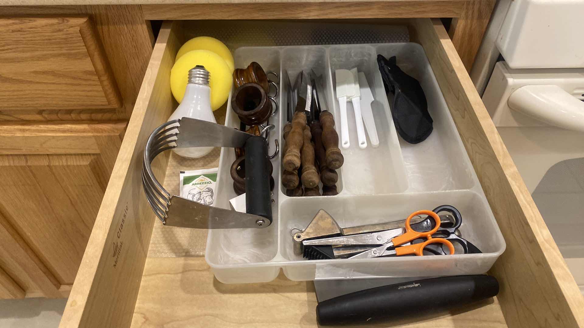 Photo 1 of CONTENTS OF KITCHEN CABINET- LARGE FLASHLIGHT & STEAK KNIVES