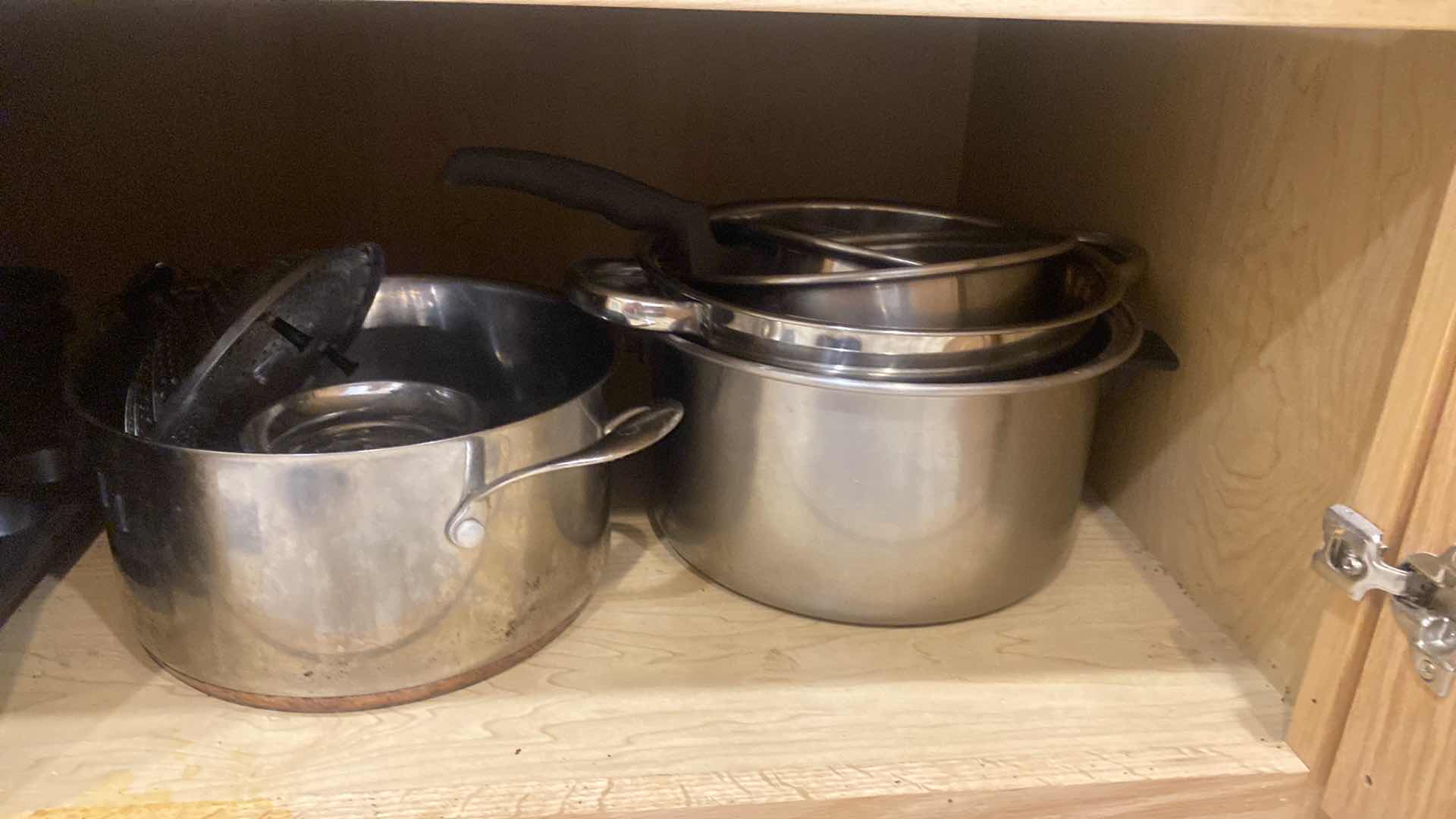 Photo 1 of CONTENTS OF KITCHEN CABINET -  POTS & PANS