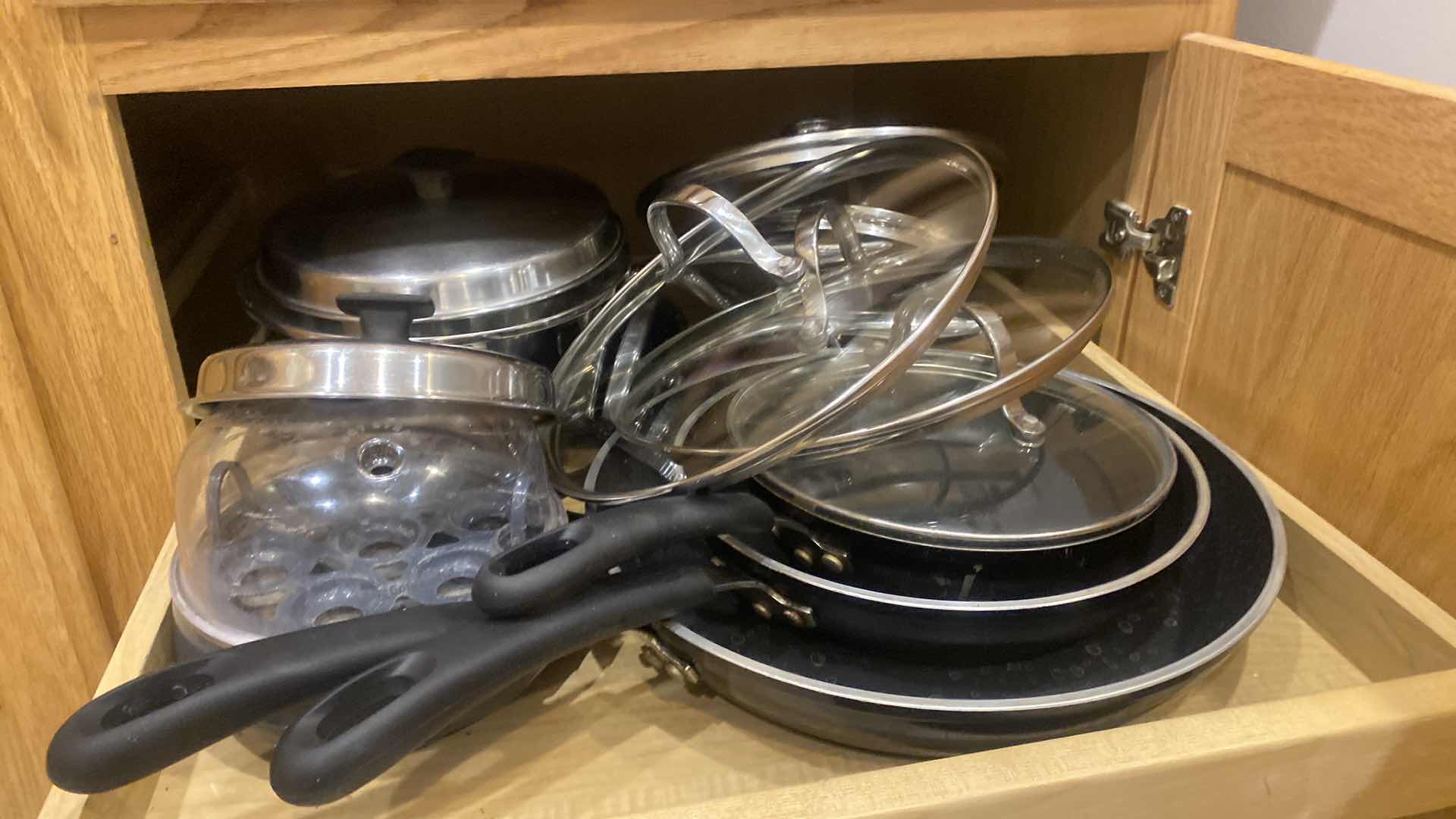 Photo 1 of CONTENTS OF KITCHEN CABINET -  POTS & PANS