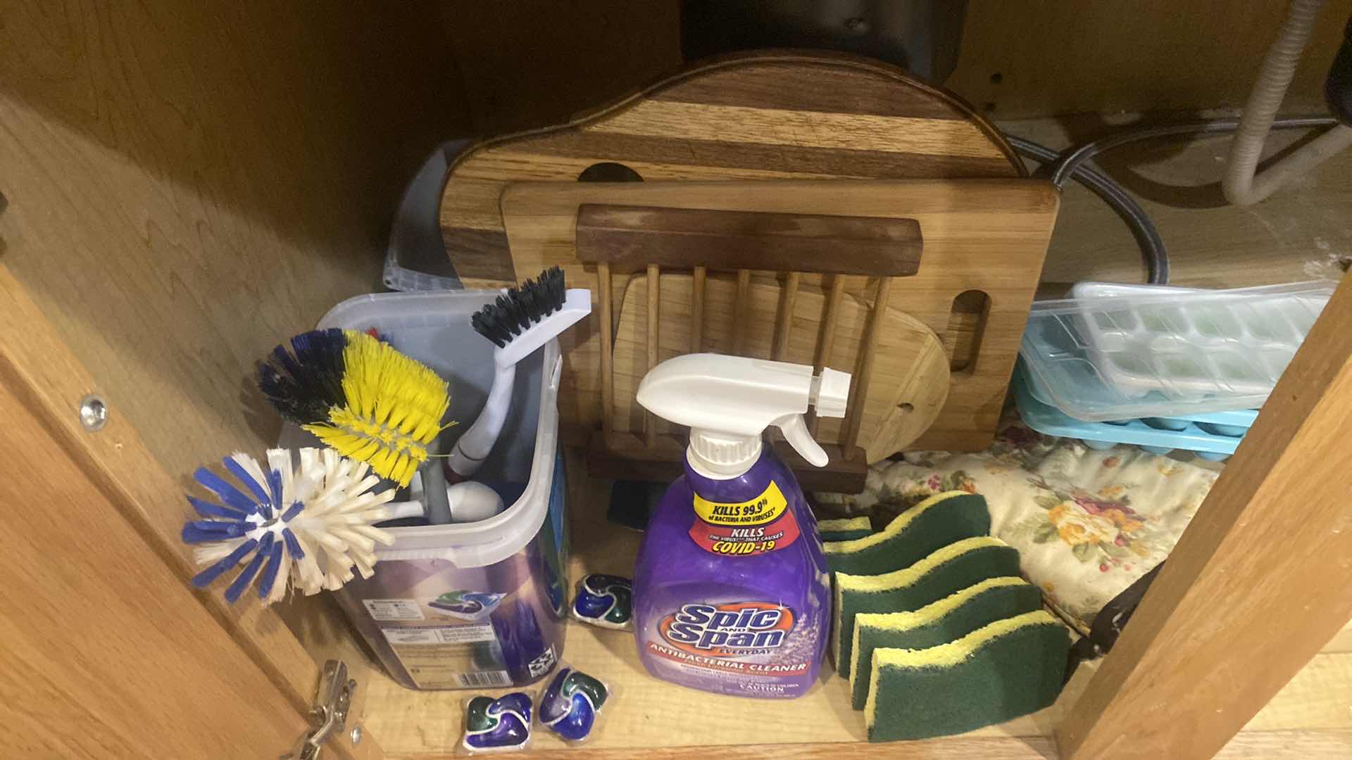 Photo 1 of CONTENTS UNDER KITCHEN SINK - CUTTING BOARDS ICE CUBE TRAYS DISHWASHER CASCADE