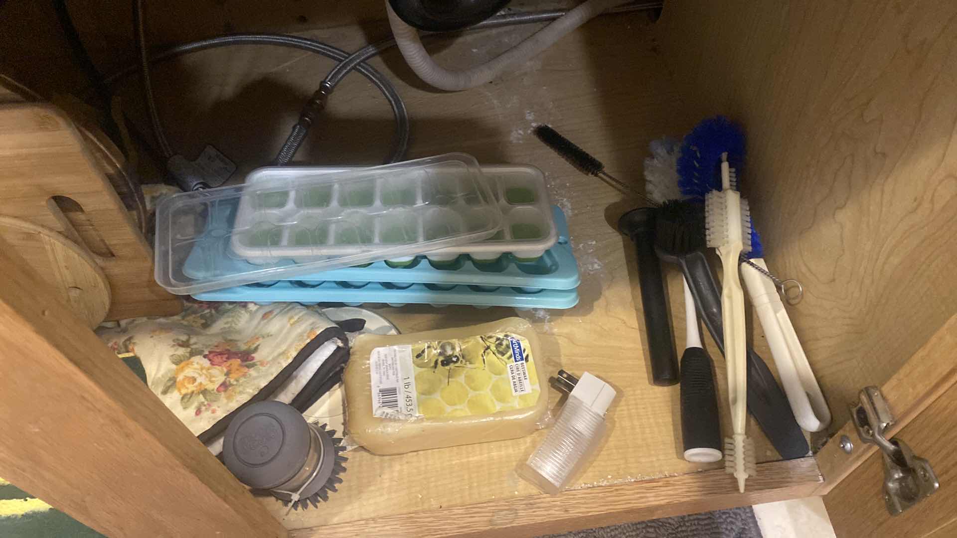 Photo 1 of CONTENTS UNDER KITCHEN SINK - CUTTING BOARDS ICE CUBE TRAYS DISHWASHER CASCADE
