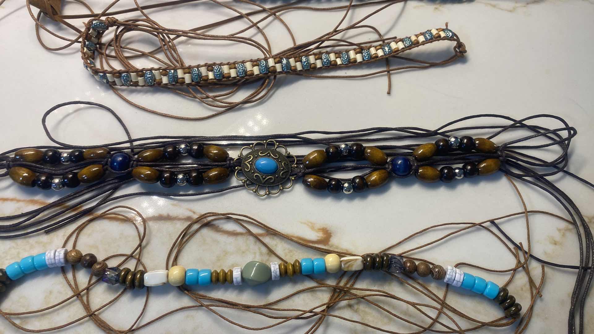 Photo 1 of NEW - 7 HAT BANDS IN REUSABLE BLACK NYLON BAG