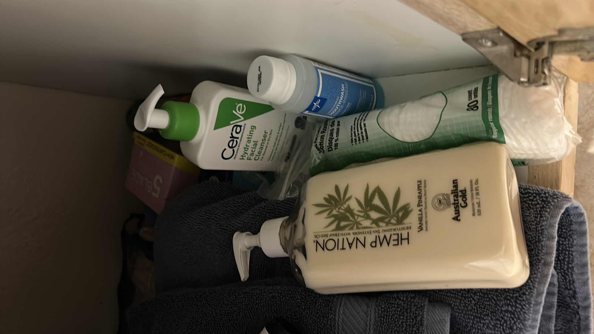 Photo 1 of CONTENTS OF CABINET IN UPSTAIRS BATHROOM