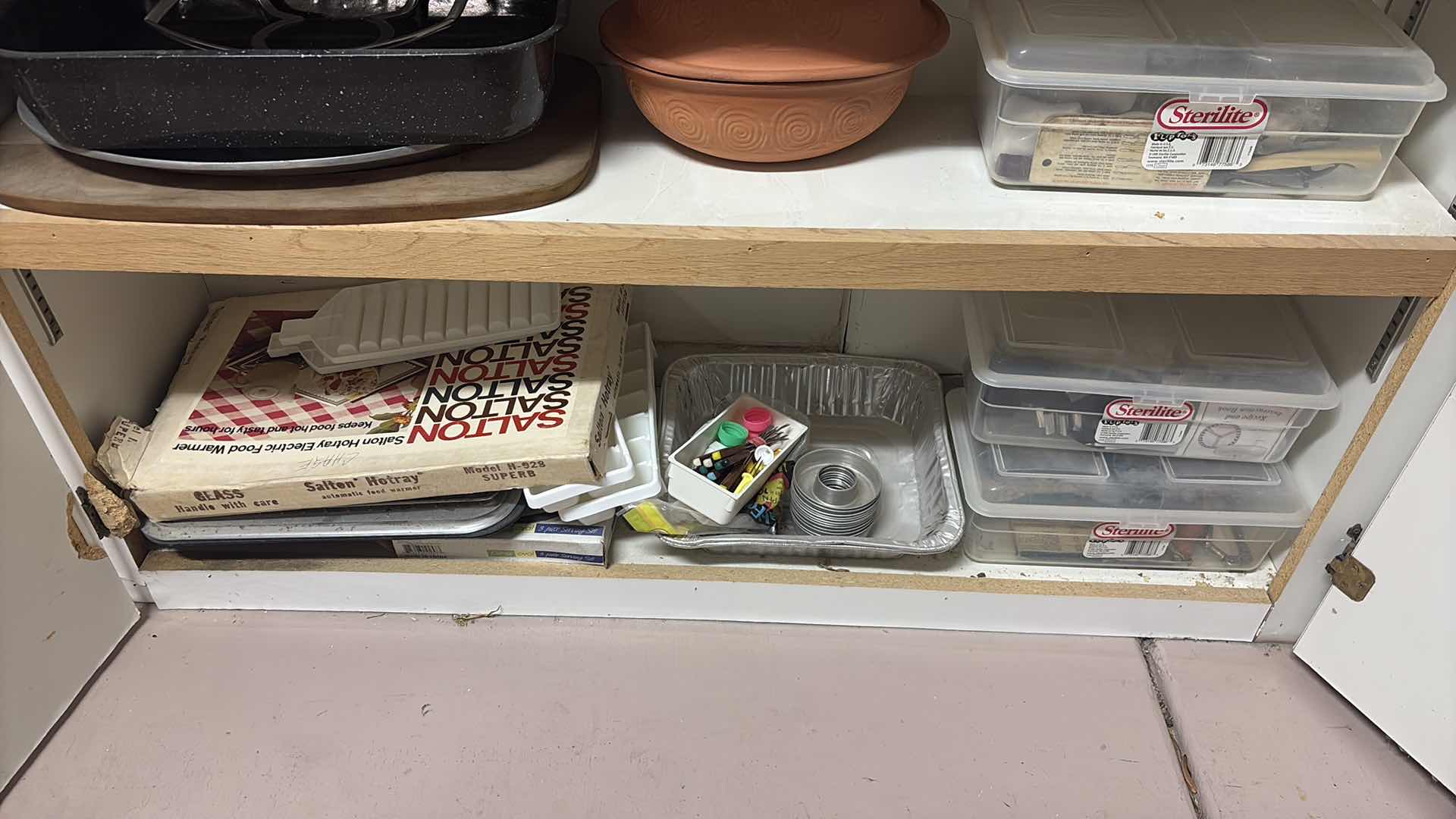 Photo 1 of CONTENTS OF CABINET- CLAY COOKING