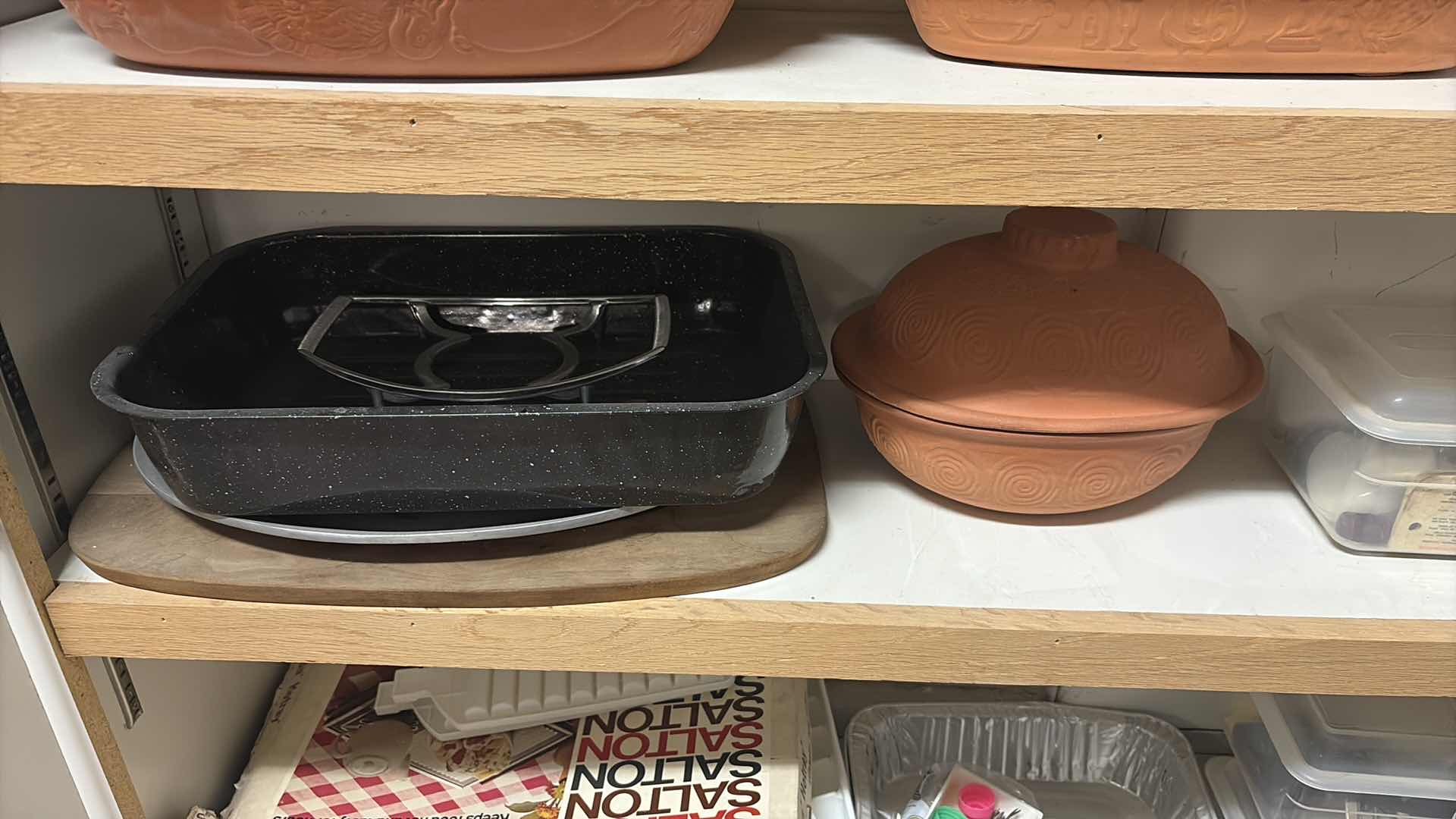 Photo 1 of CONTENTS OF CABINET- CLAY COOKING