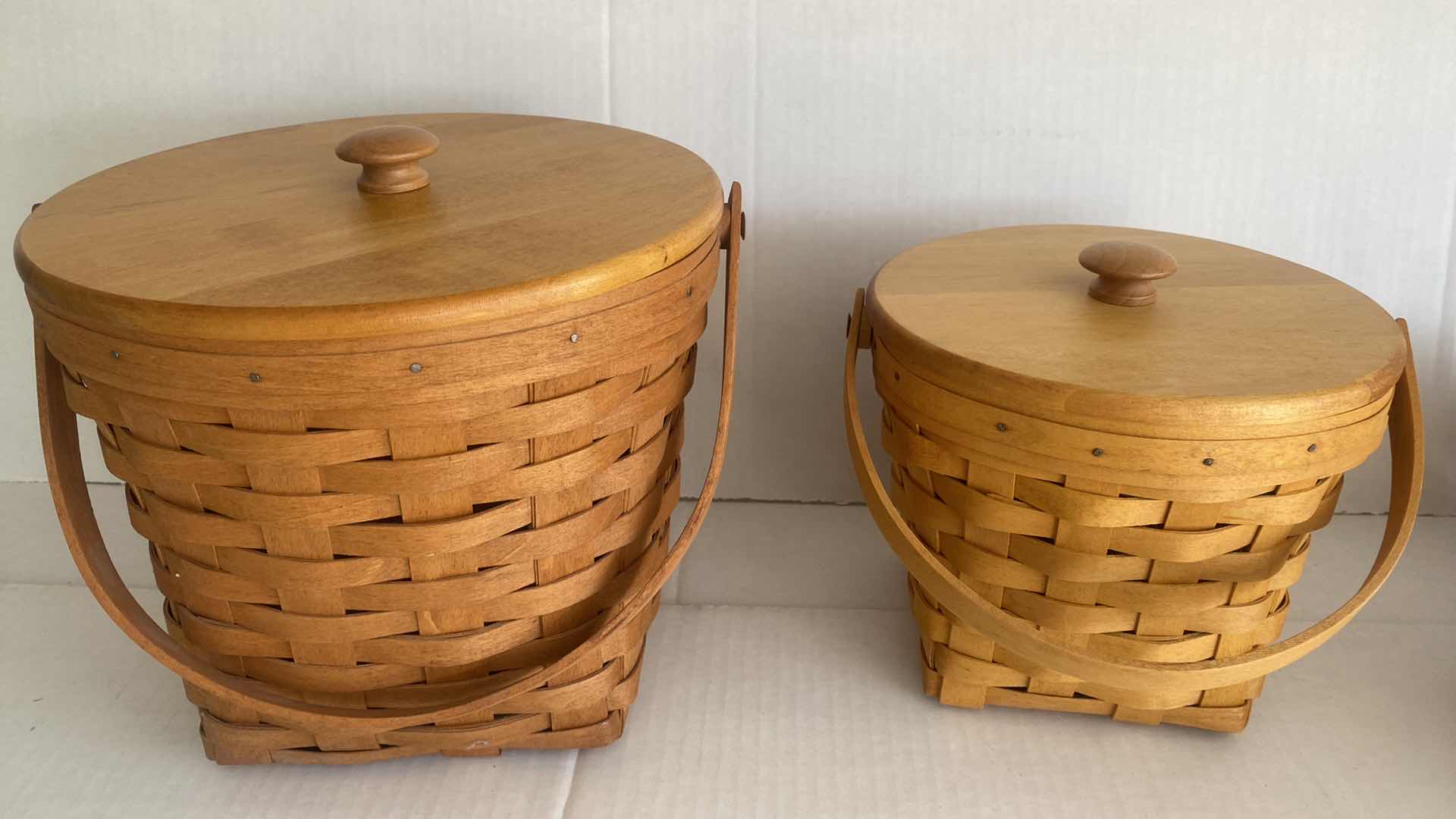 Photo 1 of 2 LONGABERGER  BASKETS WITH WOOD  LID & PLASTIC INSERT LARGEST 9” x 9”