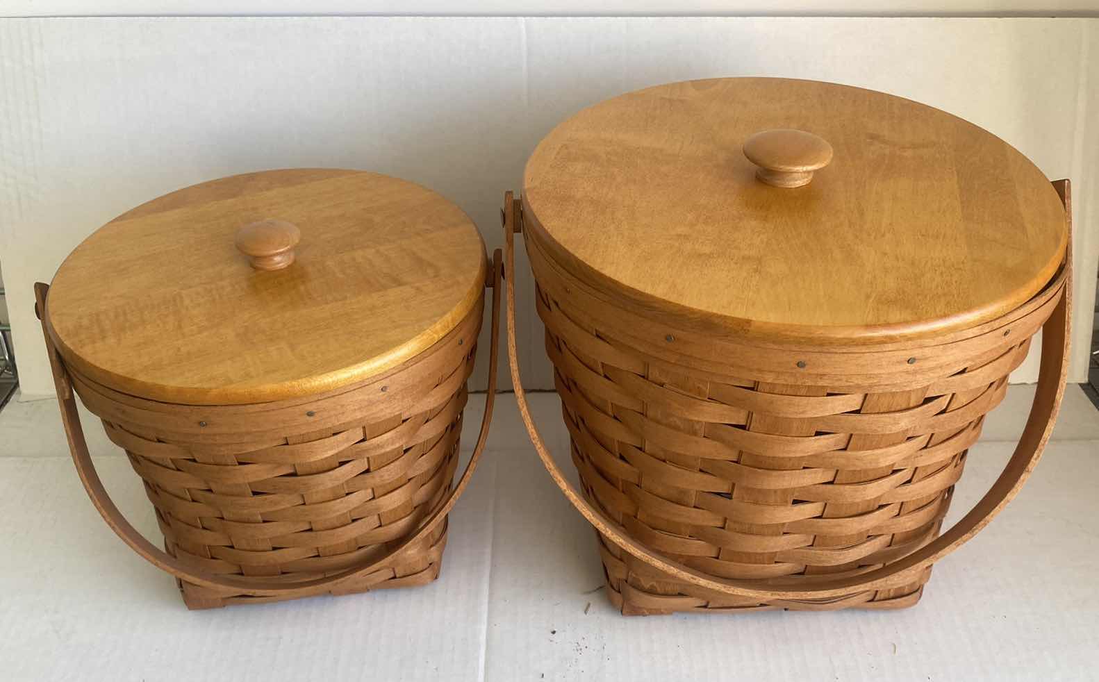 Photo 1 of 2 LONGABERGER  BASKETS WITH 2 LIDS LARGEST 11 1/2” x 11”