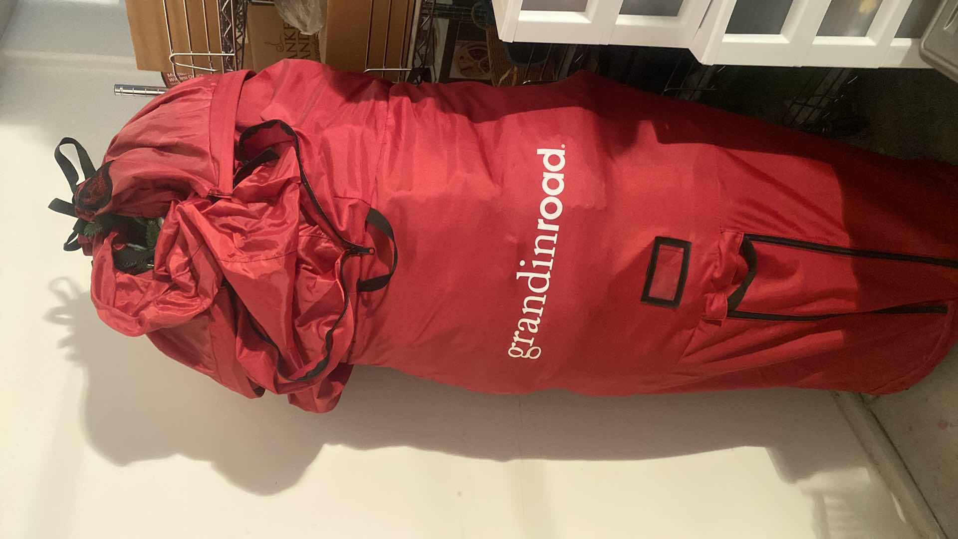 Photo 1 of 7’ ARTIFICIAL PRE LIT CLEAR LIGHTS CHRISTMAS TREE IN STORAGE BAG, SHORT NEEDLES