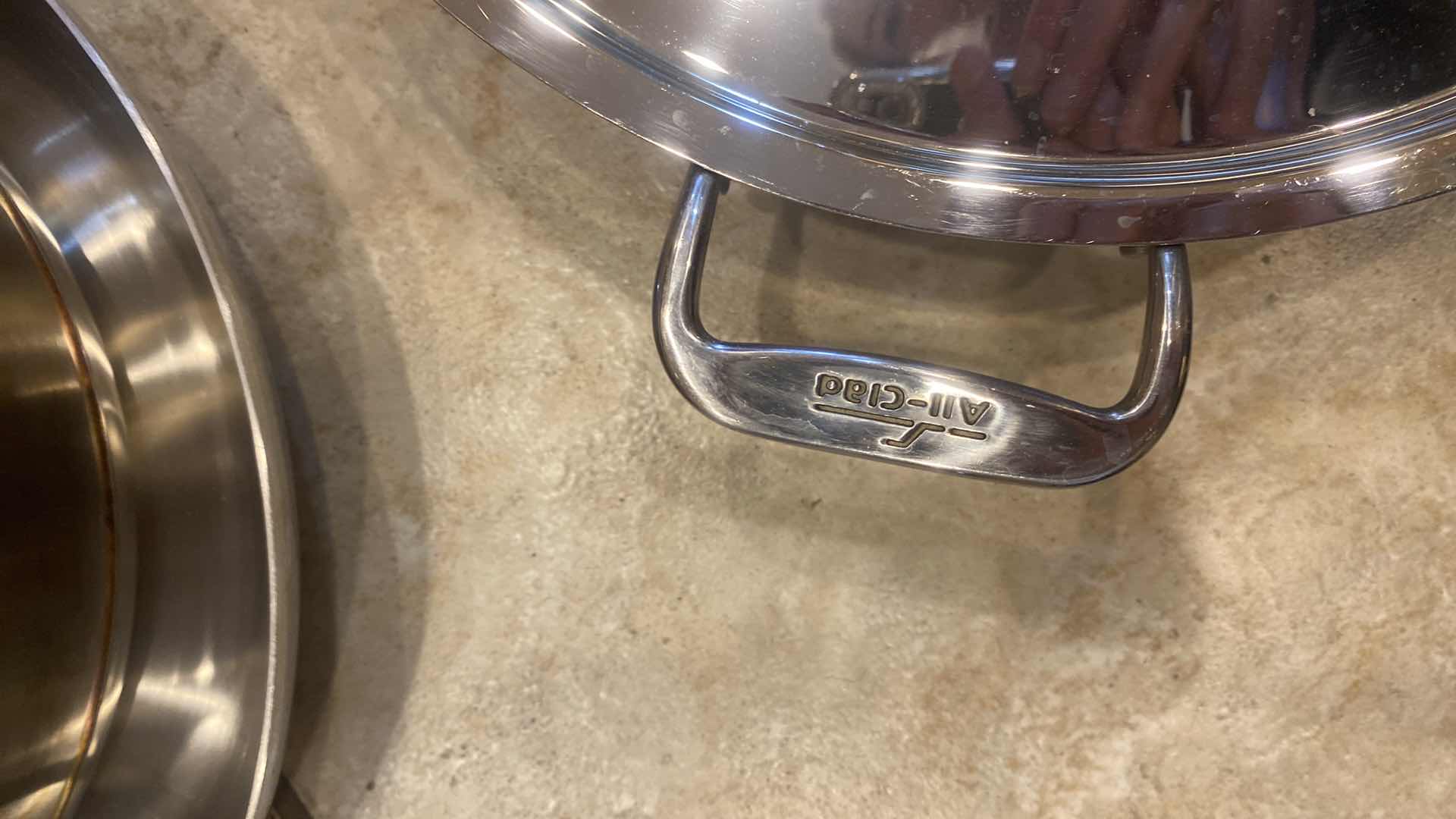 Photo 1 of 5 ALL CLAD SKILLETS WITH 3 LIDS