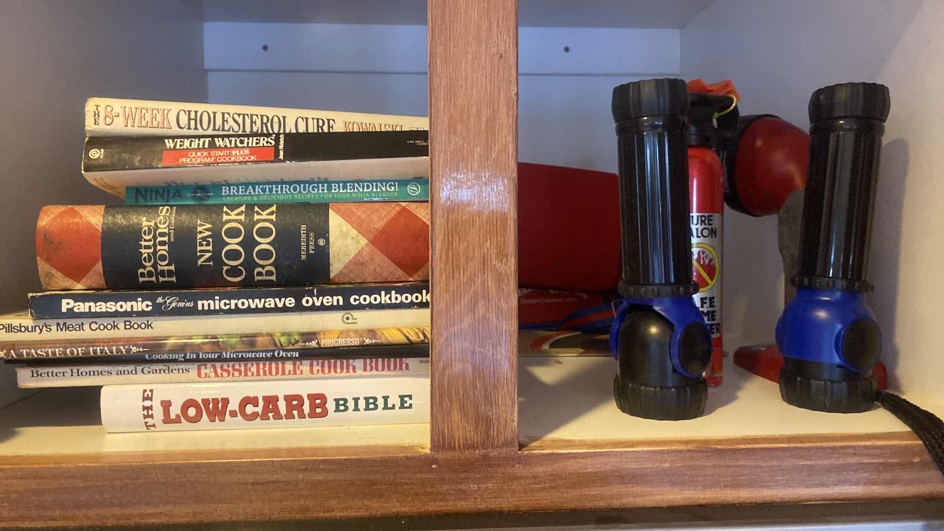 Photo 1 of CONTENTS KITCHEN CABINET -  COOKBOOKS & FLASHLIGHTS