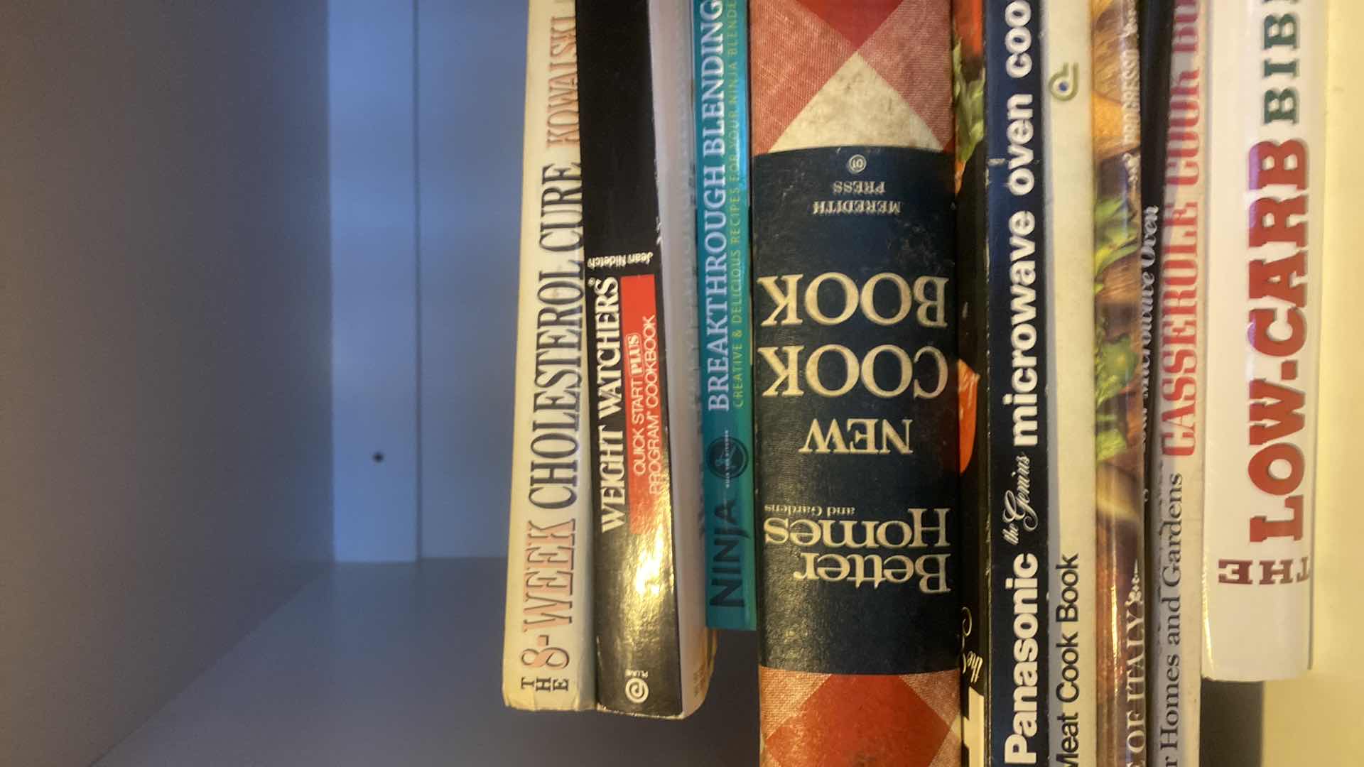 Photo 1 of CONTENTS KITCHEN CABINET -  COOKBOOKS & FLASHLIGHTS