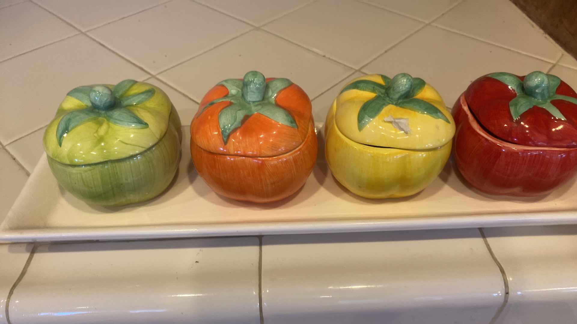 Photo 1 of CONTENTS KITCHEN CABINET -  POT HOLDERS TOWELS & 5 PIECE CERAMIC PEPPER SET