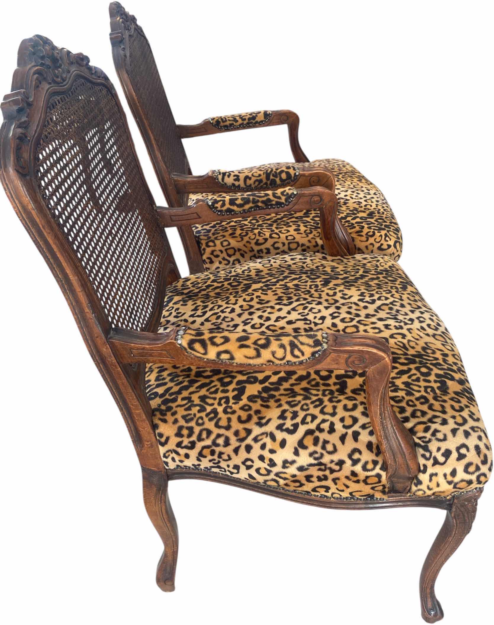 Photo 1 of 2 - WOOD LEOPARD PRINT WITH CANE BACK OCCASIONAL CHAIRS (1 ADDITIONAL SET OF 2 AVAILABLE SOLD SEPARATELY)