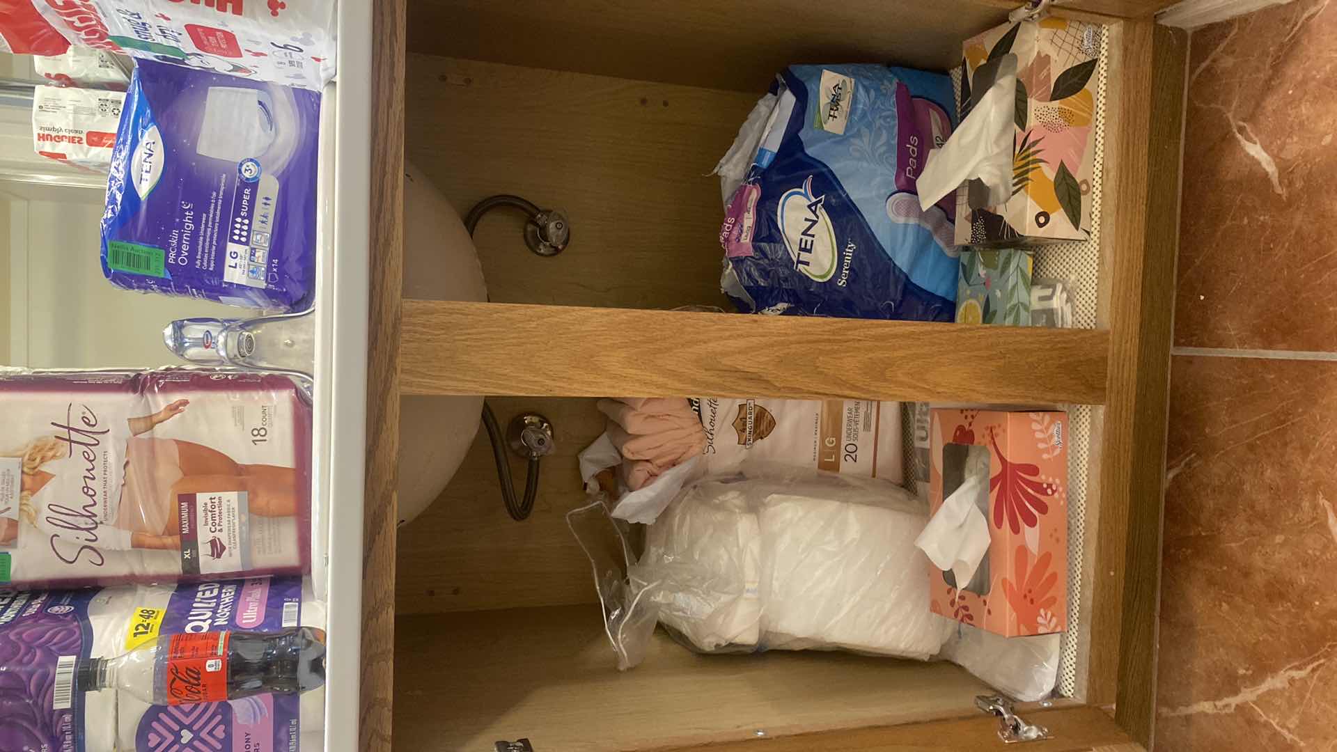 Photo 1 of CONTENTS IN CABINET - WOMENS PERSONAL CARE & KLEENEX